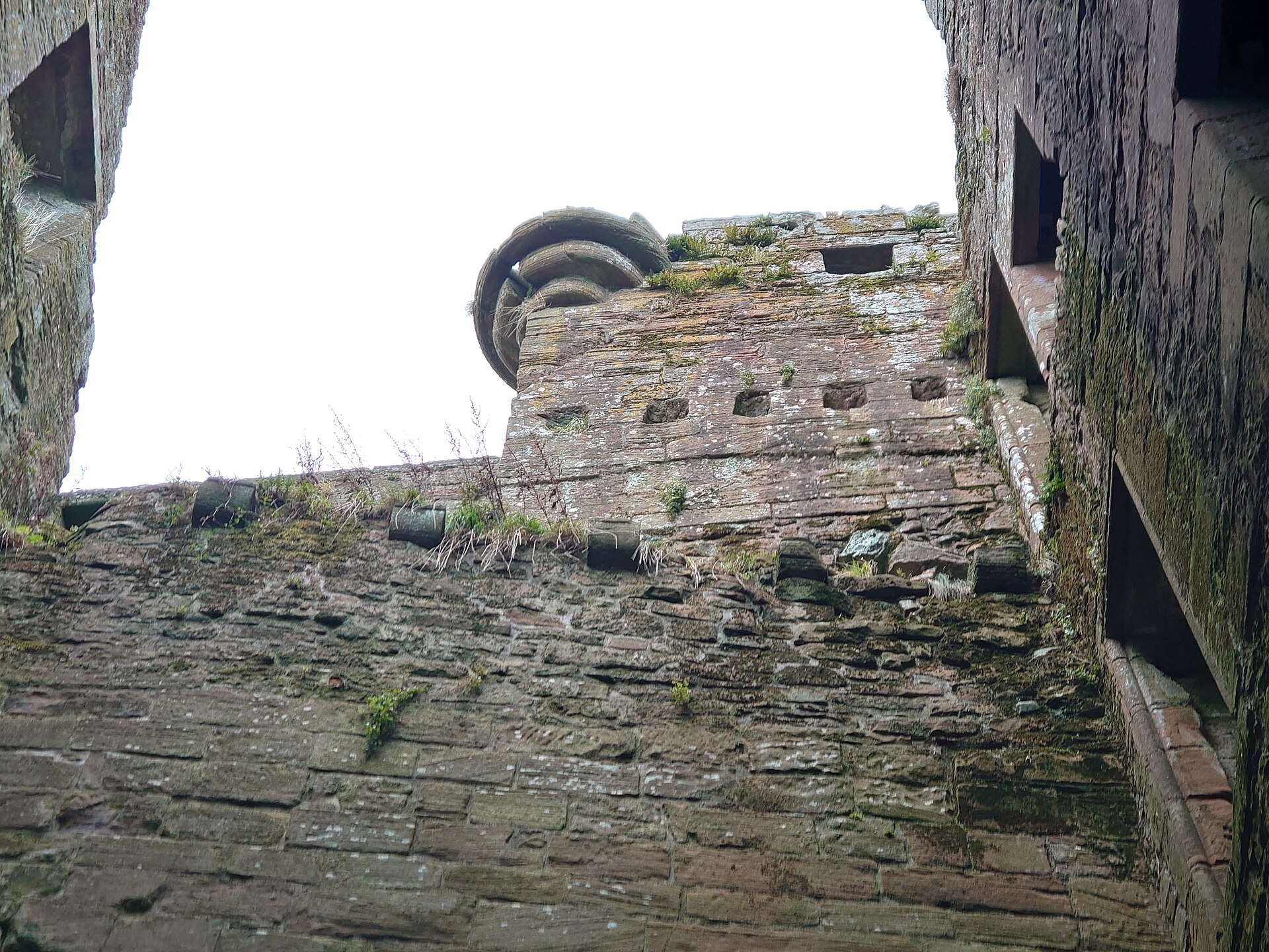 The gatehouse seen across the water, guarding the only entrance to the triangular castle