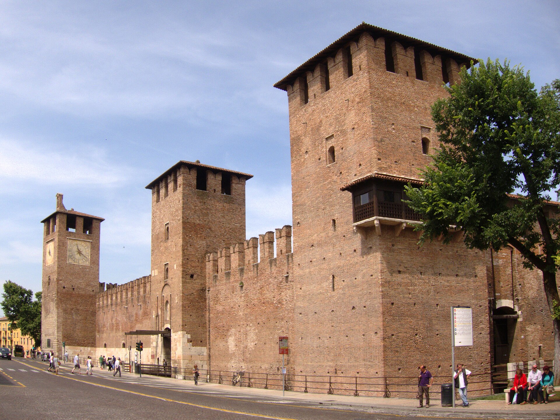 Castelvecchio's stern brick walls and square towers rise beside the Adige.