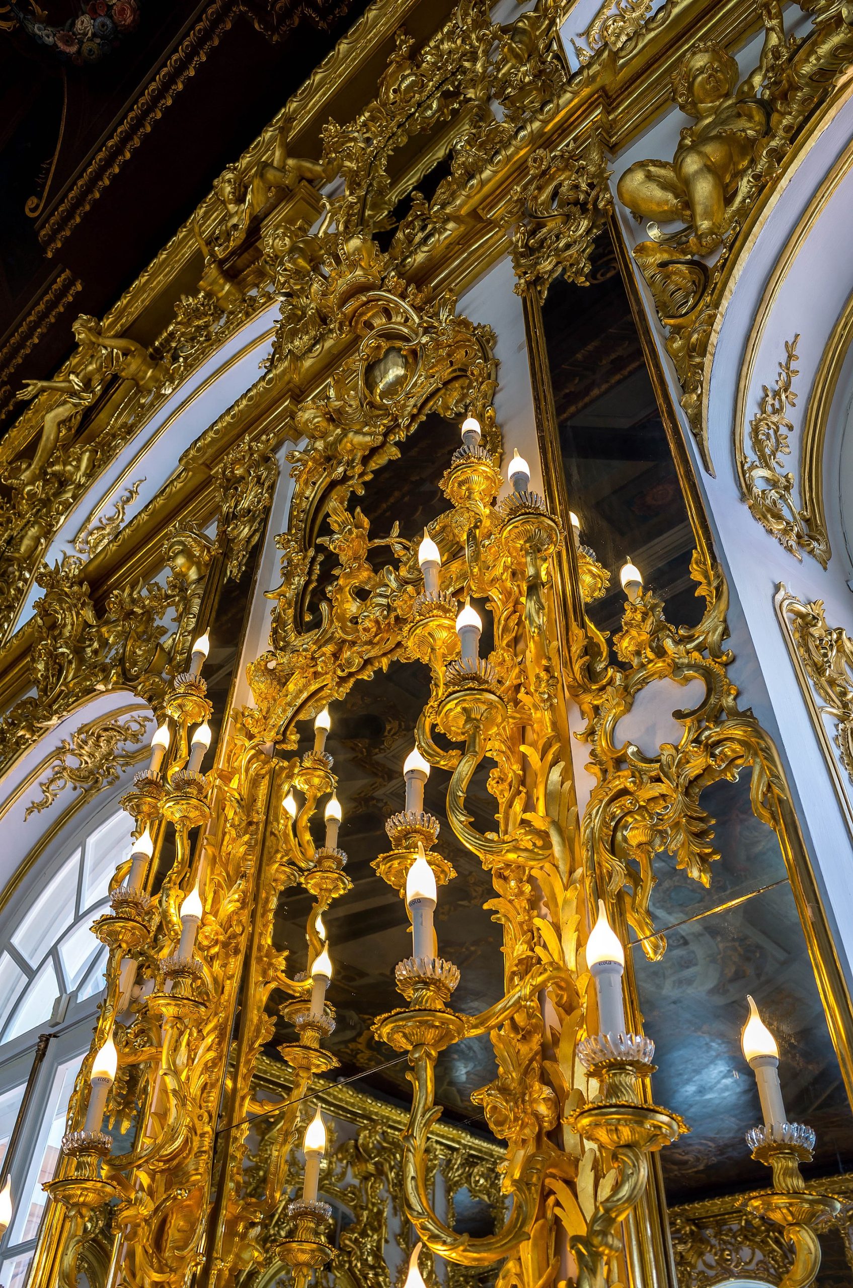A restored interior showing the density of gilded ornament that covers the palace walls.