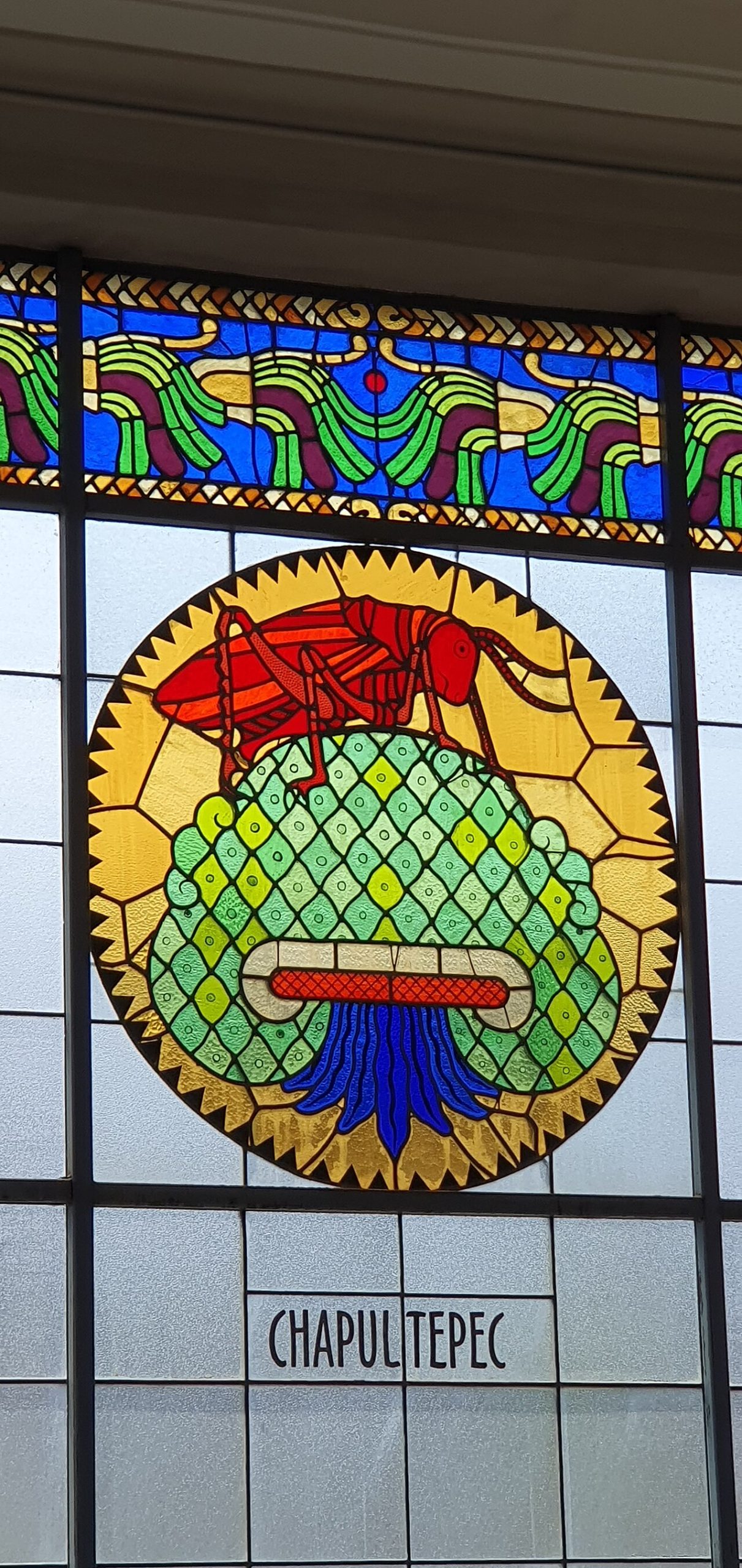 A stained-glass window on the staircase of the lions, a treasure of the castle's decoration.