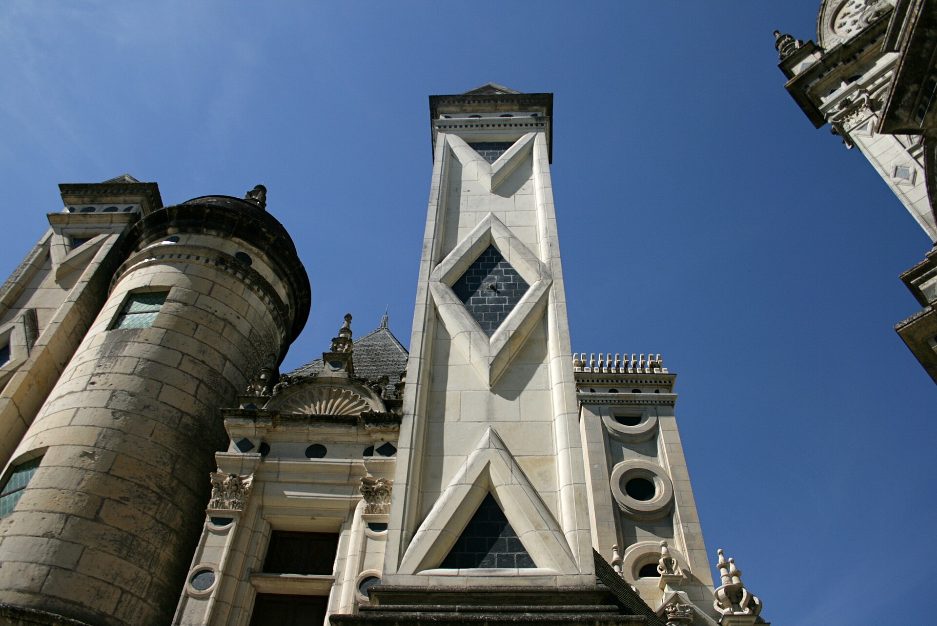 A carved chimney at Chambord, bearing the king's salamander emblem