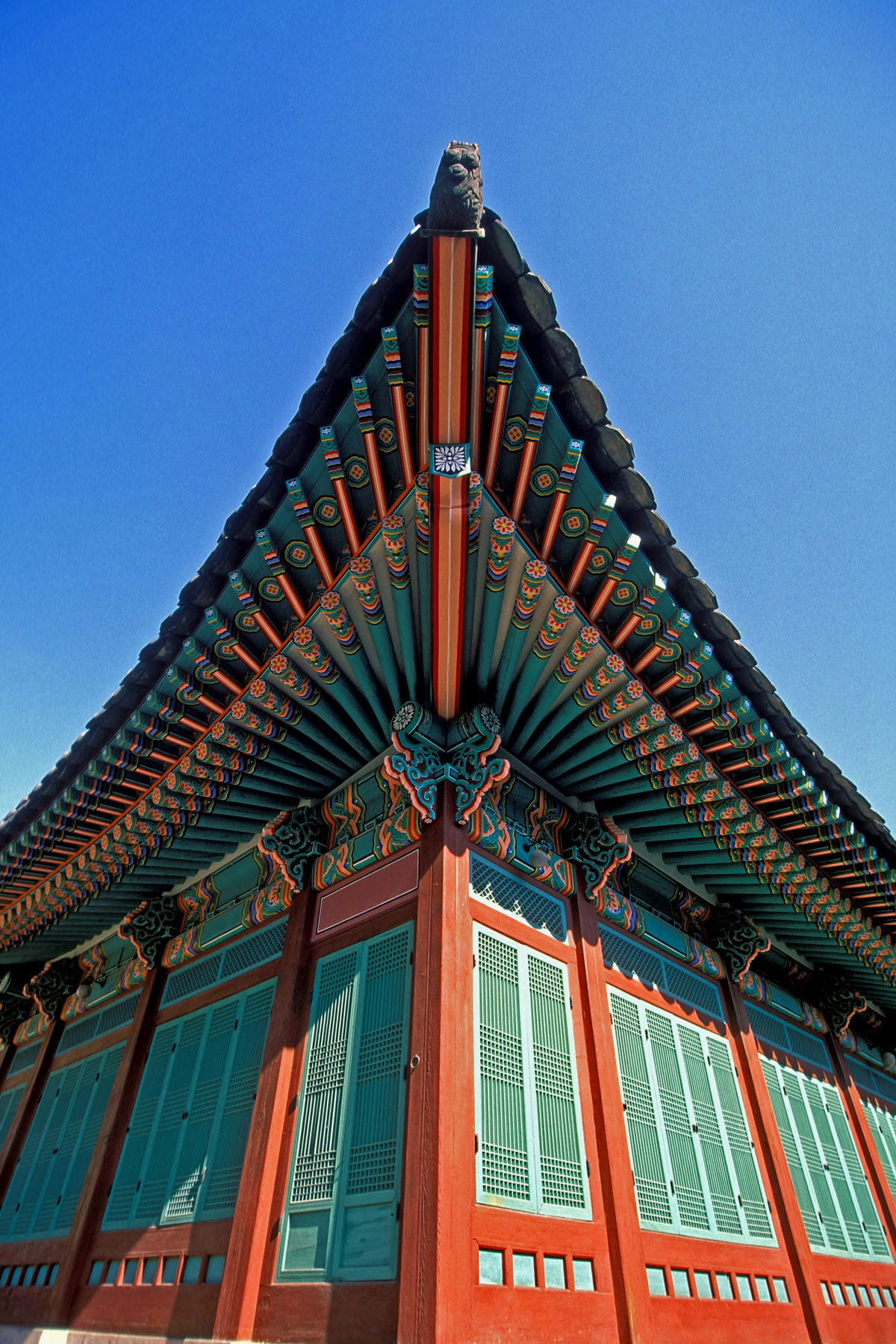The painted eaves of the palace, adorned with the colorful dancheong patterns.