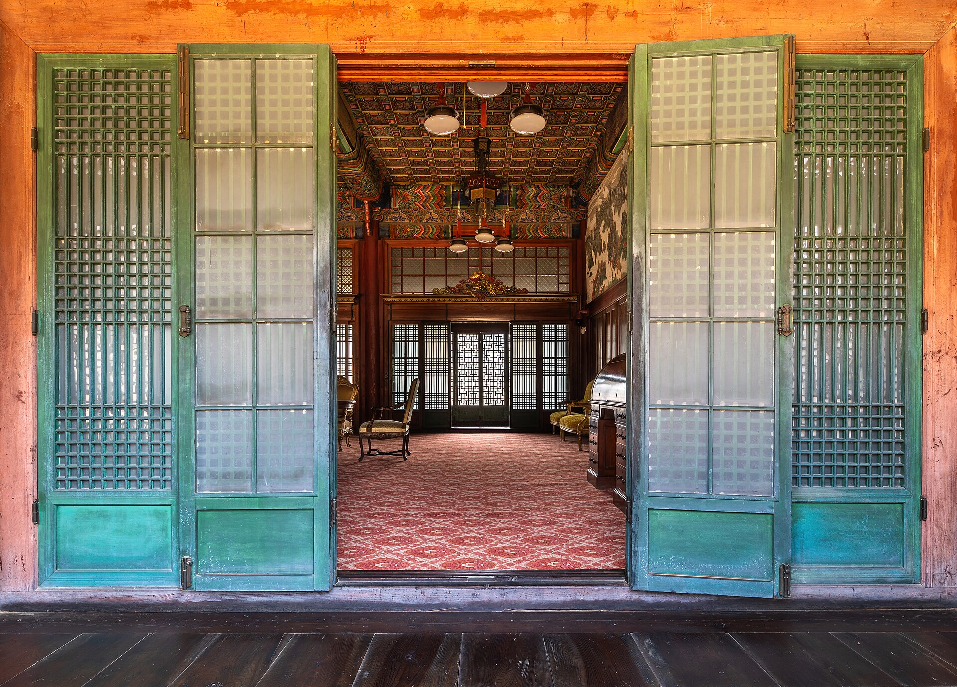 The interior of a hall at Changdeokgung, seen through its open doors.