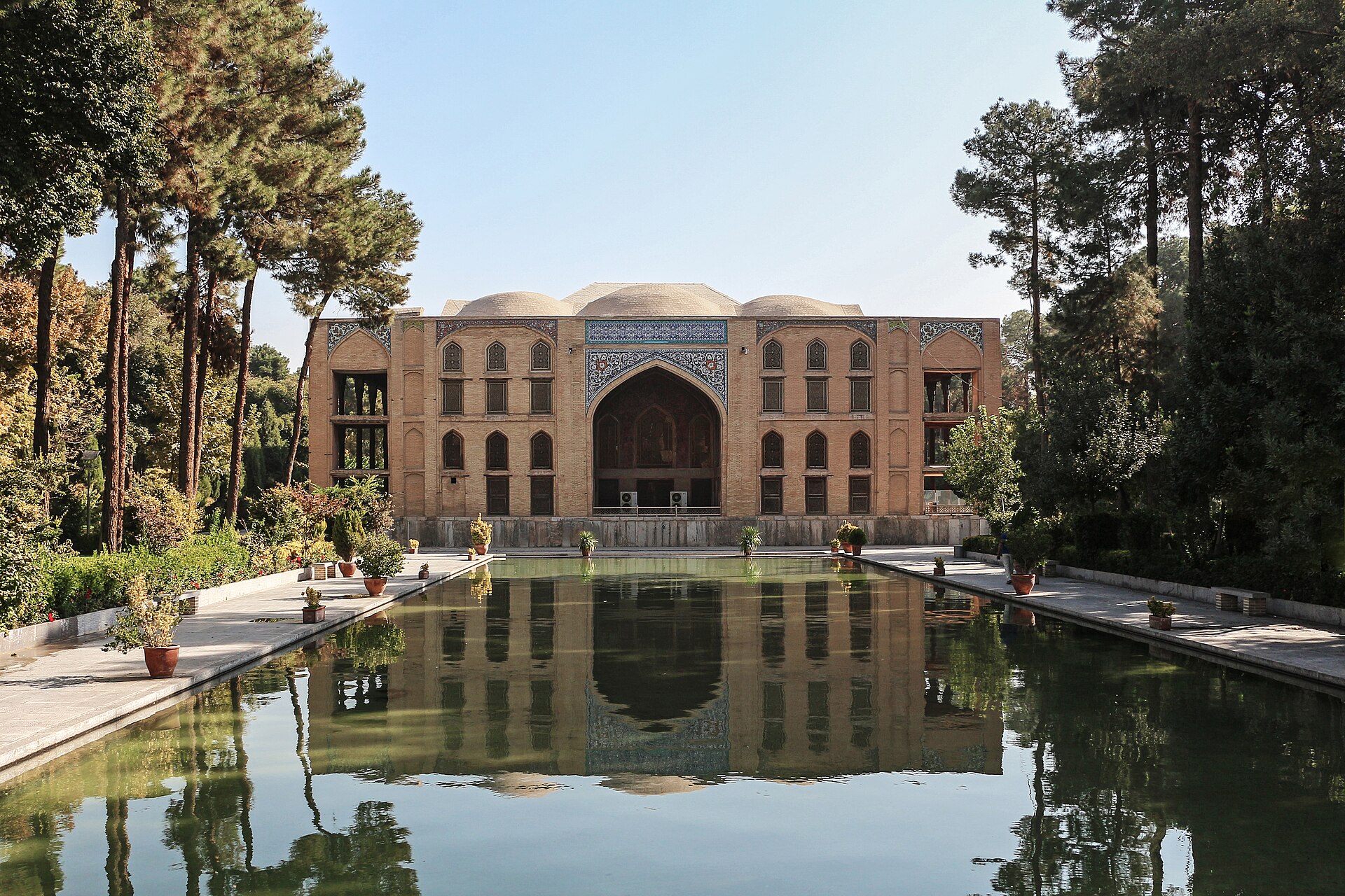 A view of the Chehel Sotoun, its slender columns rising above the columned porch.