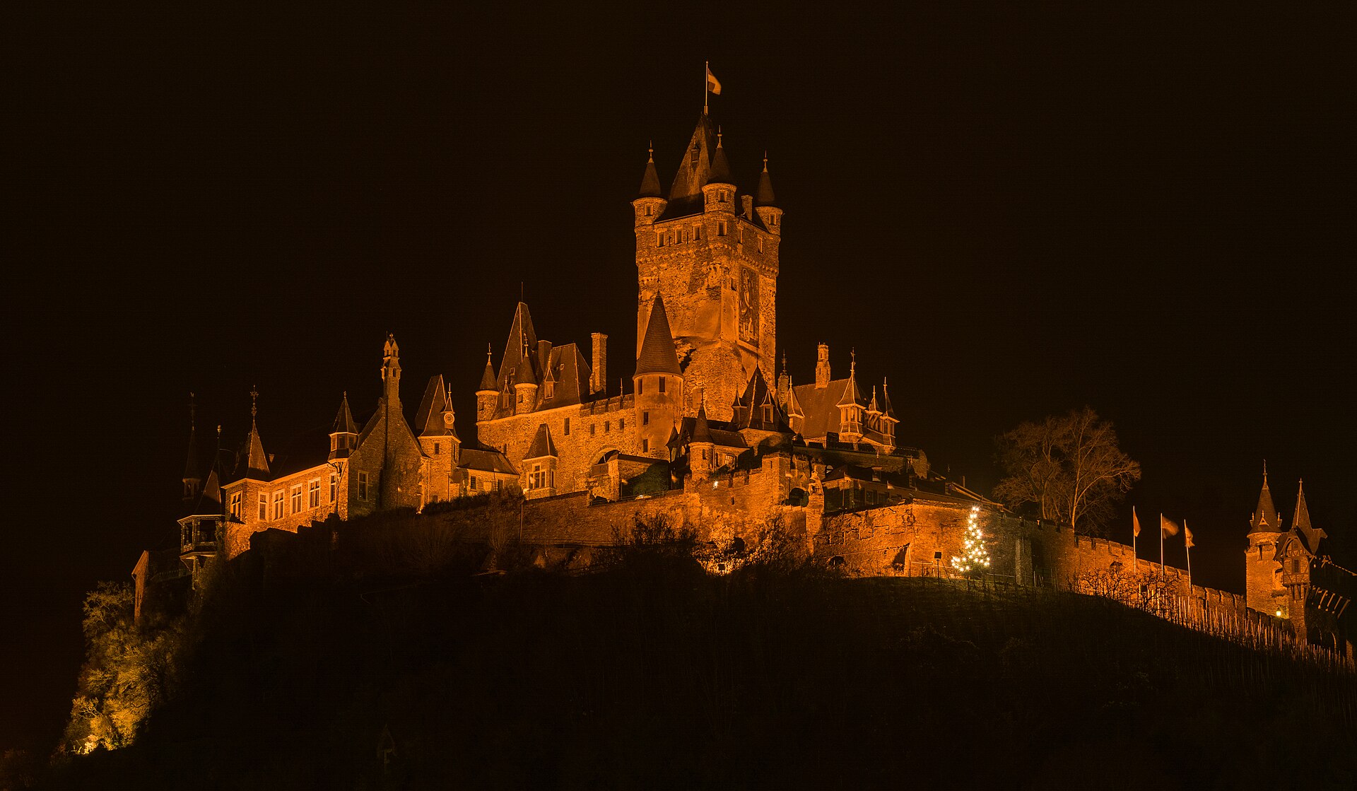 The castle glowing above Cochem at night, a beloved landmark of the Moselle