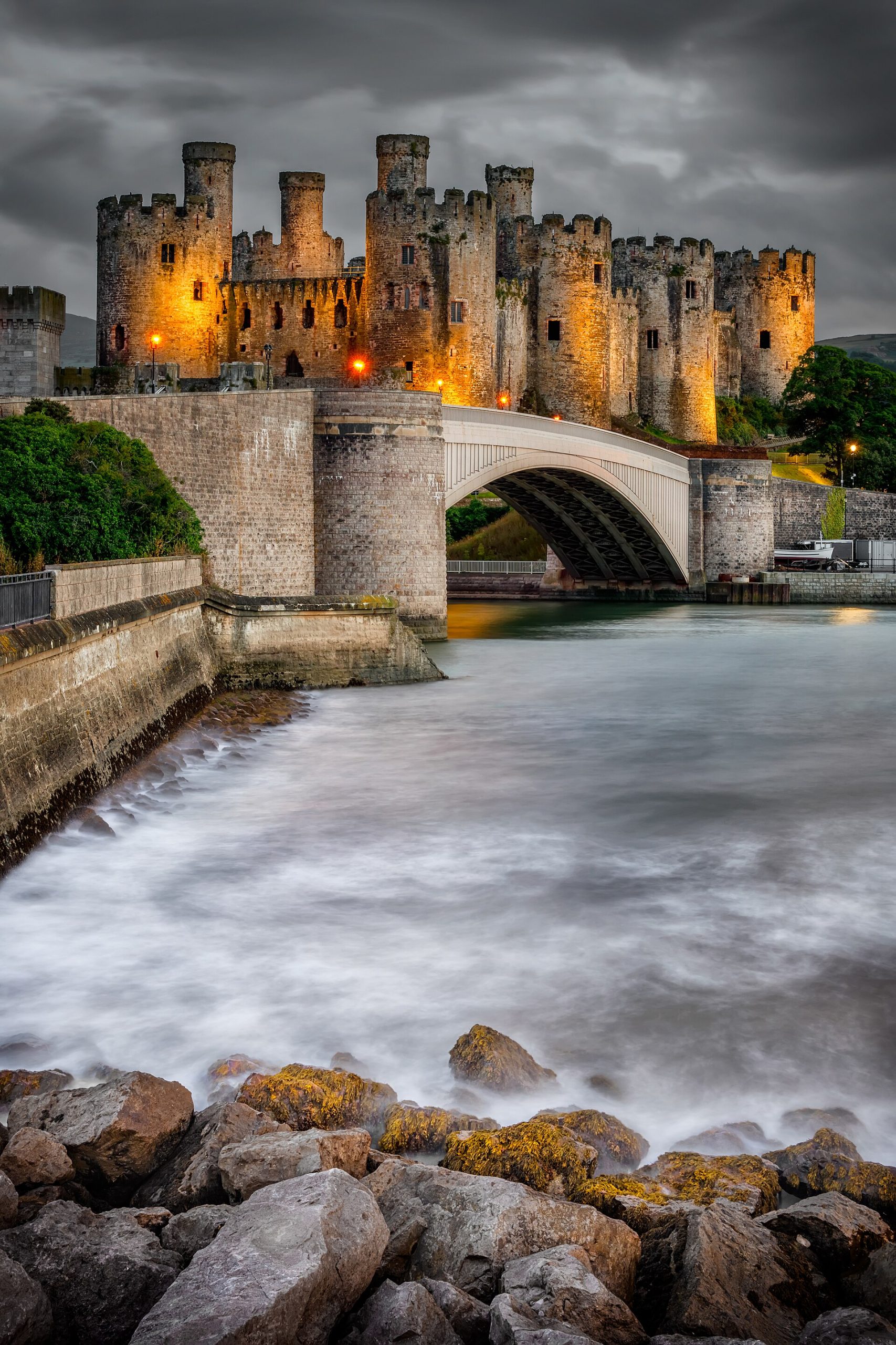 The castle floodlit at night, part of a complete circuit of medieval town walls