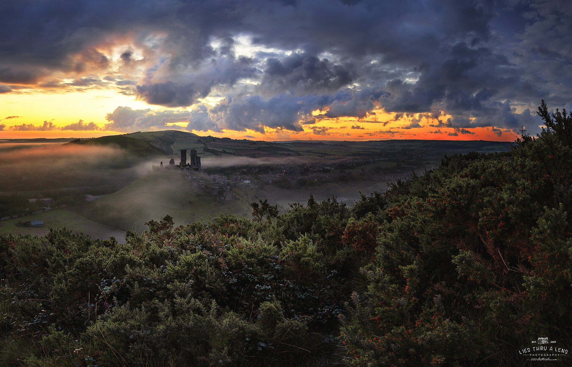 Corfe rising out of the morning mist, one of the most romantic ruins in England