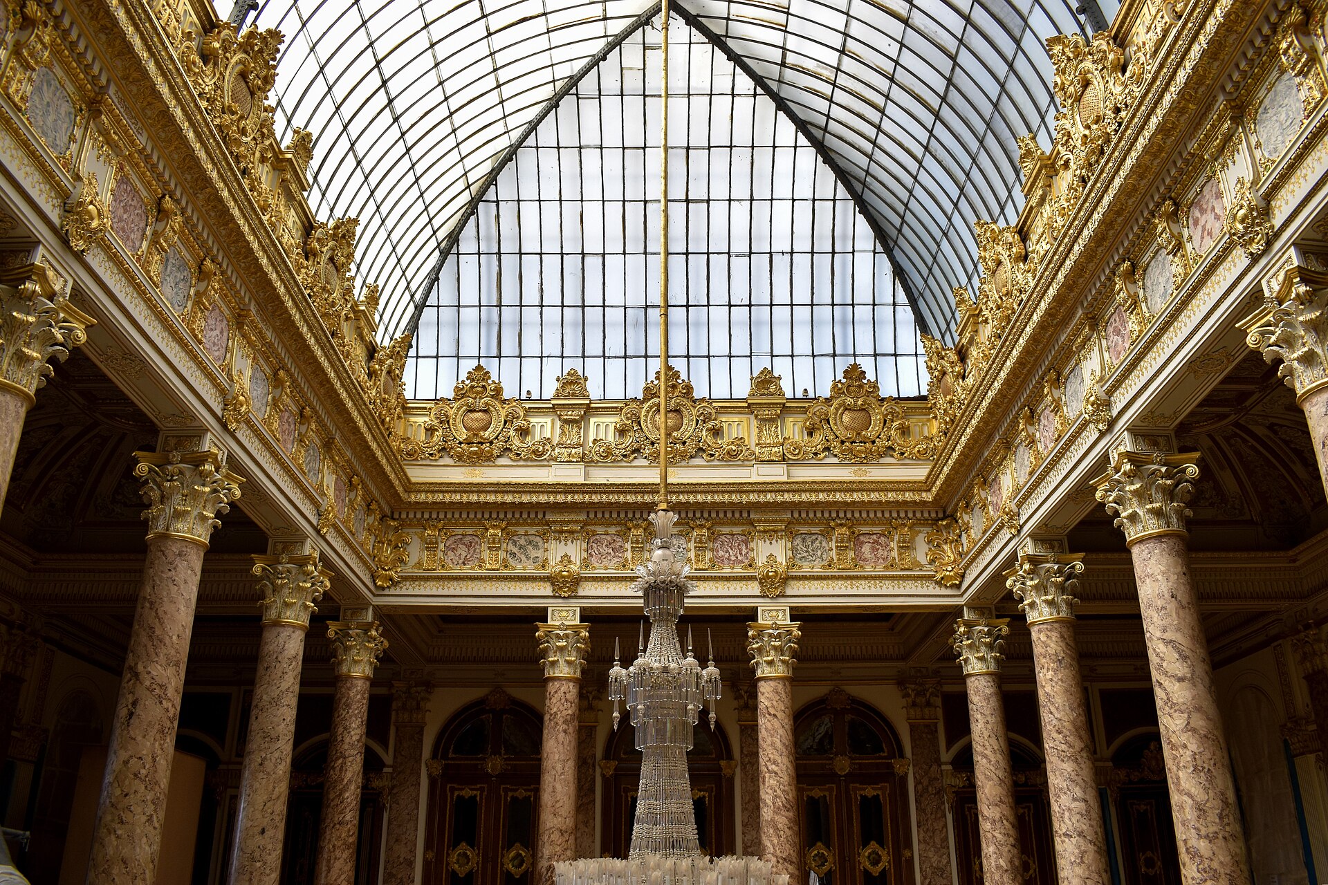 The Crystal Staircase, its balusters made of crystal, glittering beneath a great chandelier.