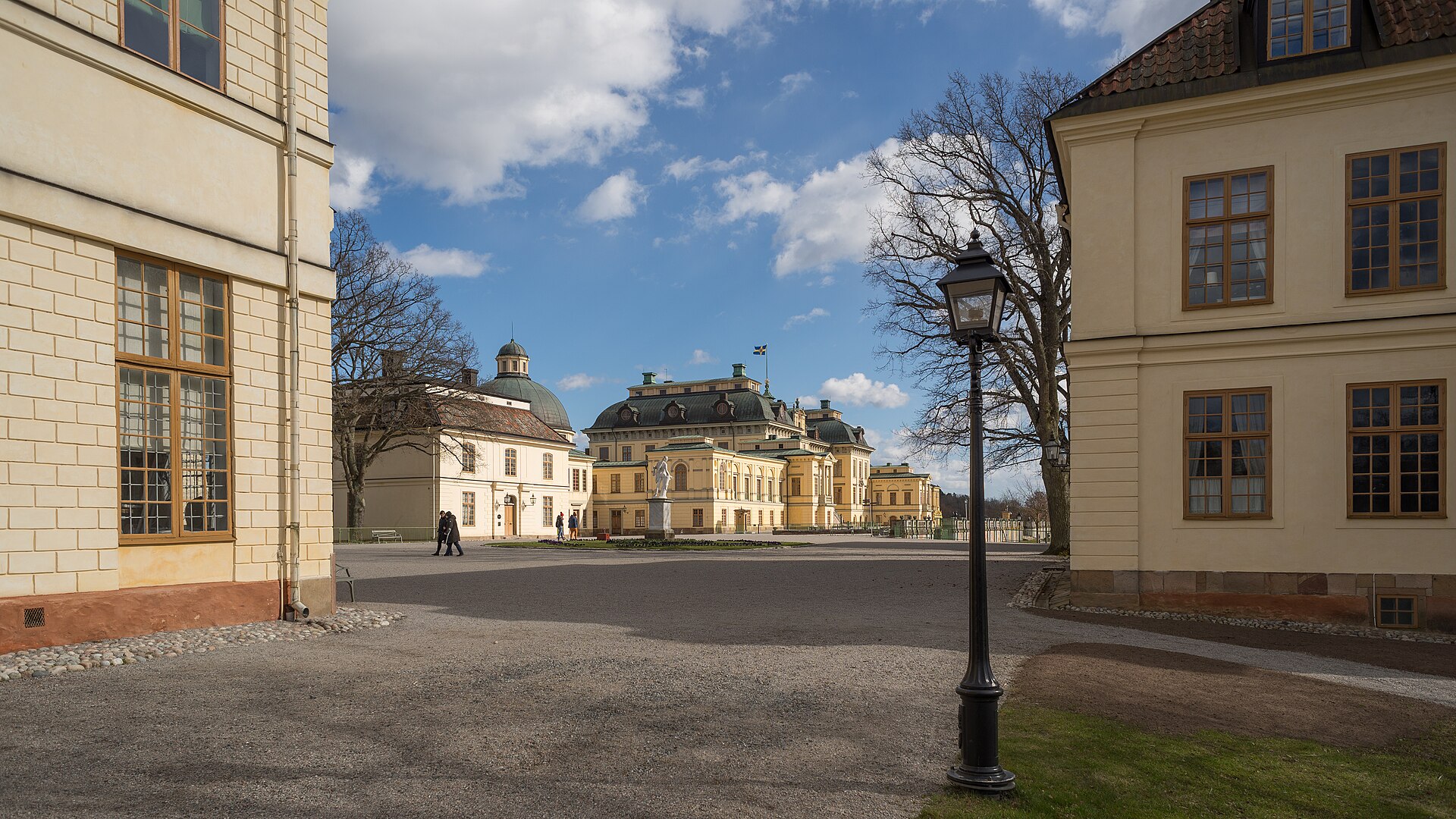 The long baroque facade of Drottningholm reflected in the spring light