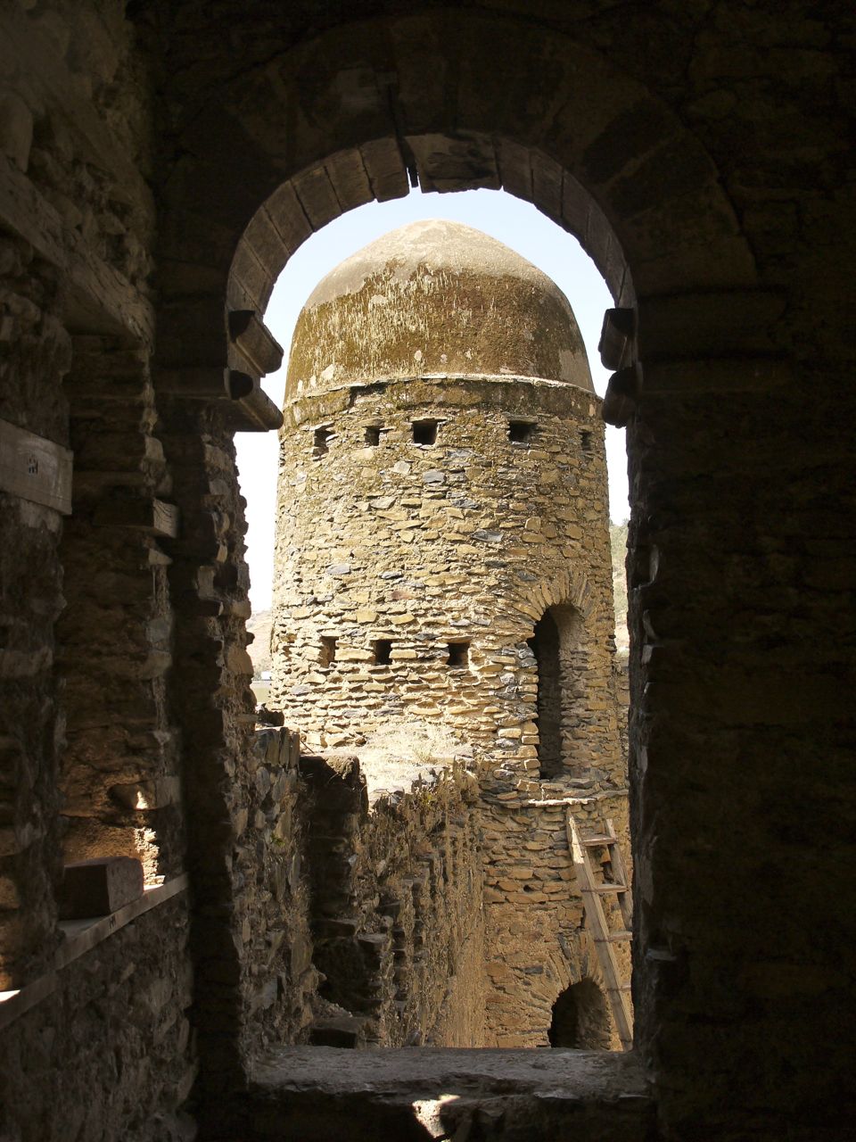 A view of the compound, its castles rising within the enclosing walls.