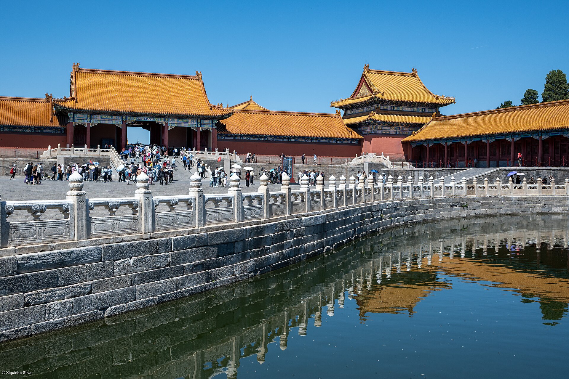 The Golden Water River winding through the courtyards, crossed by marble bridges.