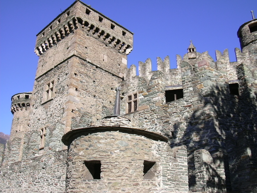 The many towers of Fenis rise in tiers above the valley floor.