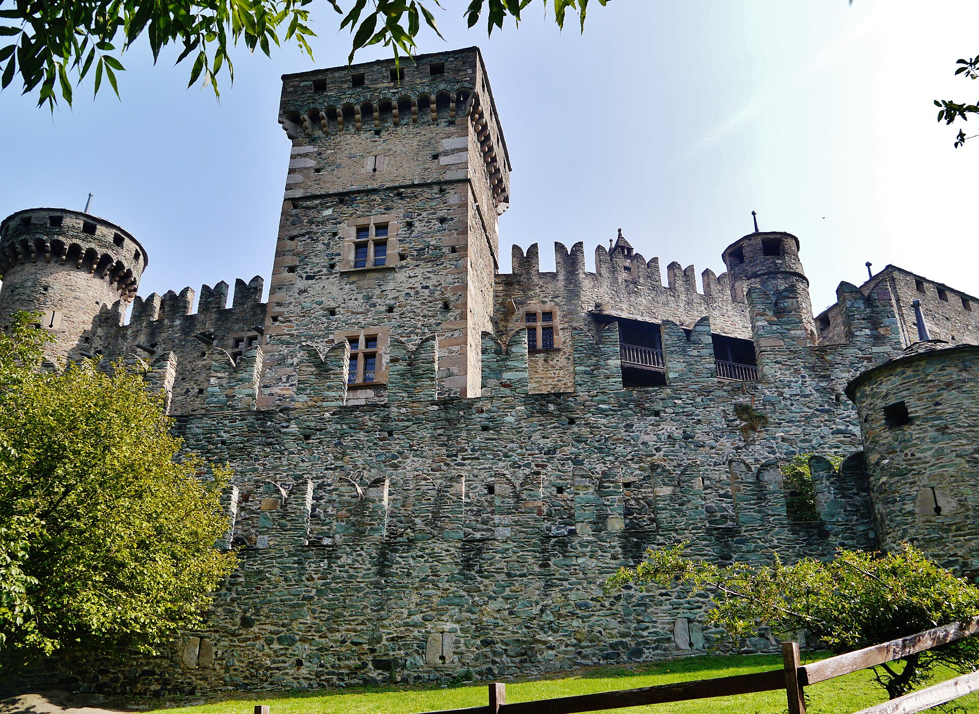 The irregular pentagonal core gives Fenis its unmistakable, many-towered outline.