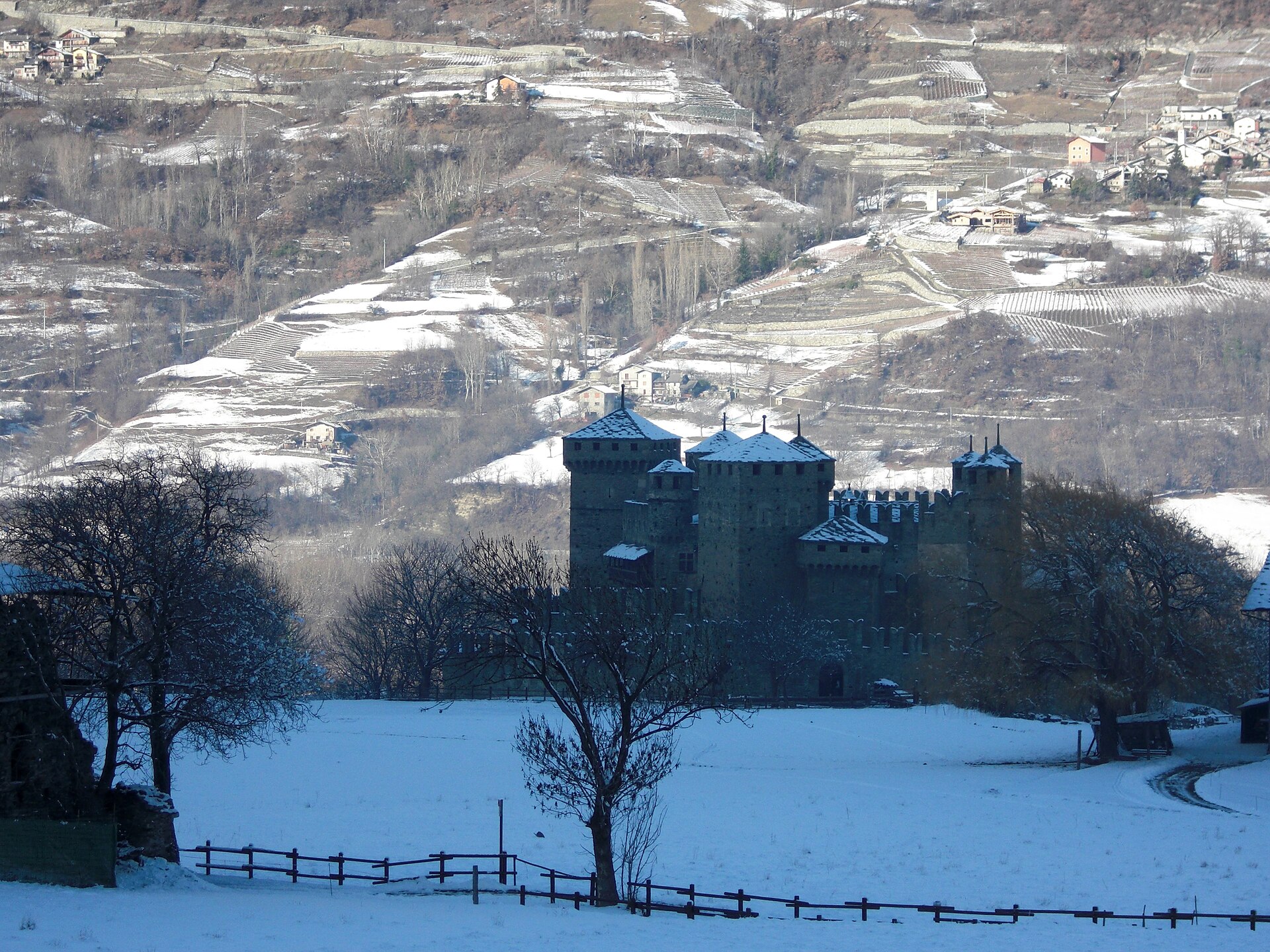Under snow, the tiered towers of Fenis look like a page from a medieval manuscript.