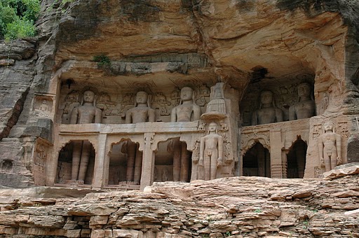 The hillsides are carved with hundreds of colossal Jain sculptures, some over 17 meters tall.