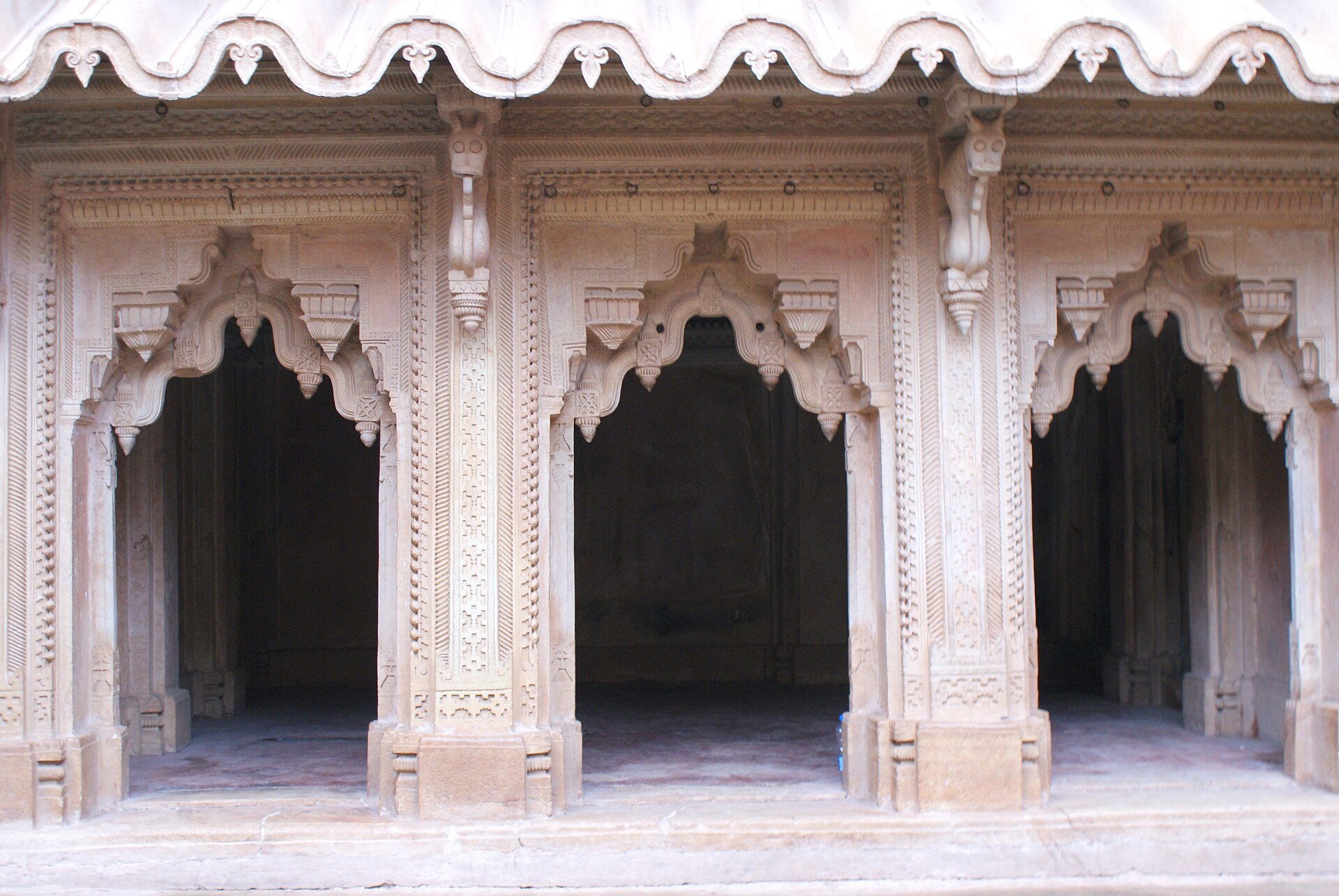 Carved stonework within the Man Mandir complex