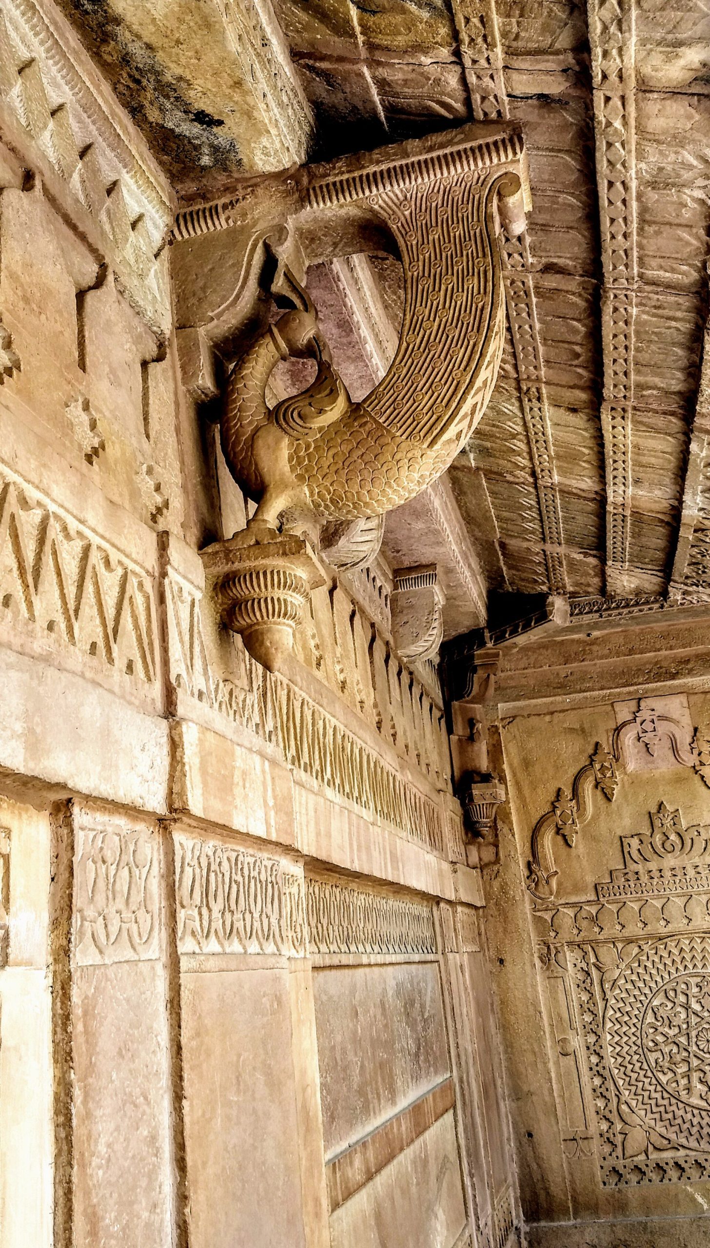 Peacock brackets carved in the stone of the palace