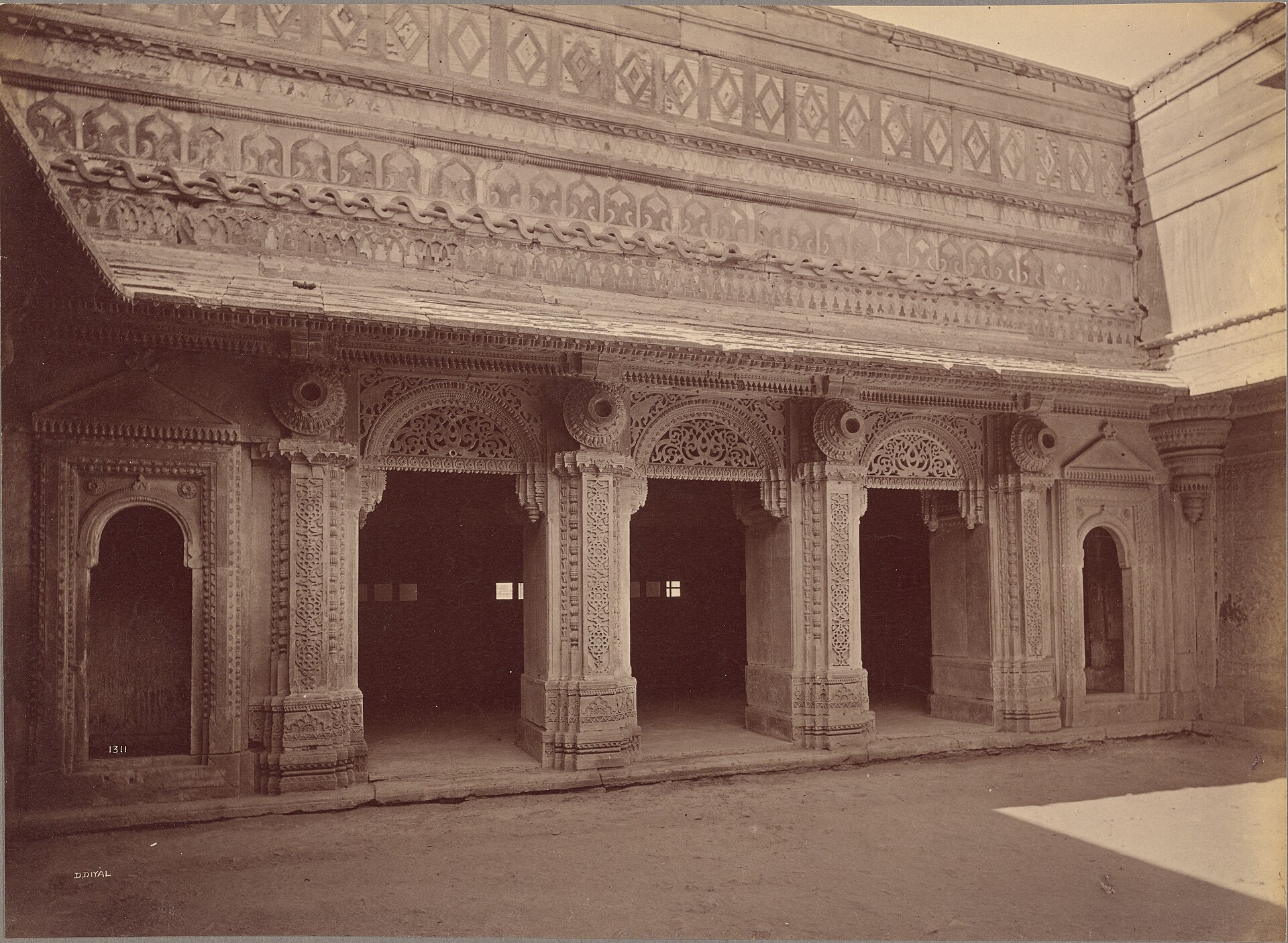 A carved figure in the outer courtyard of the palace