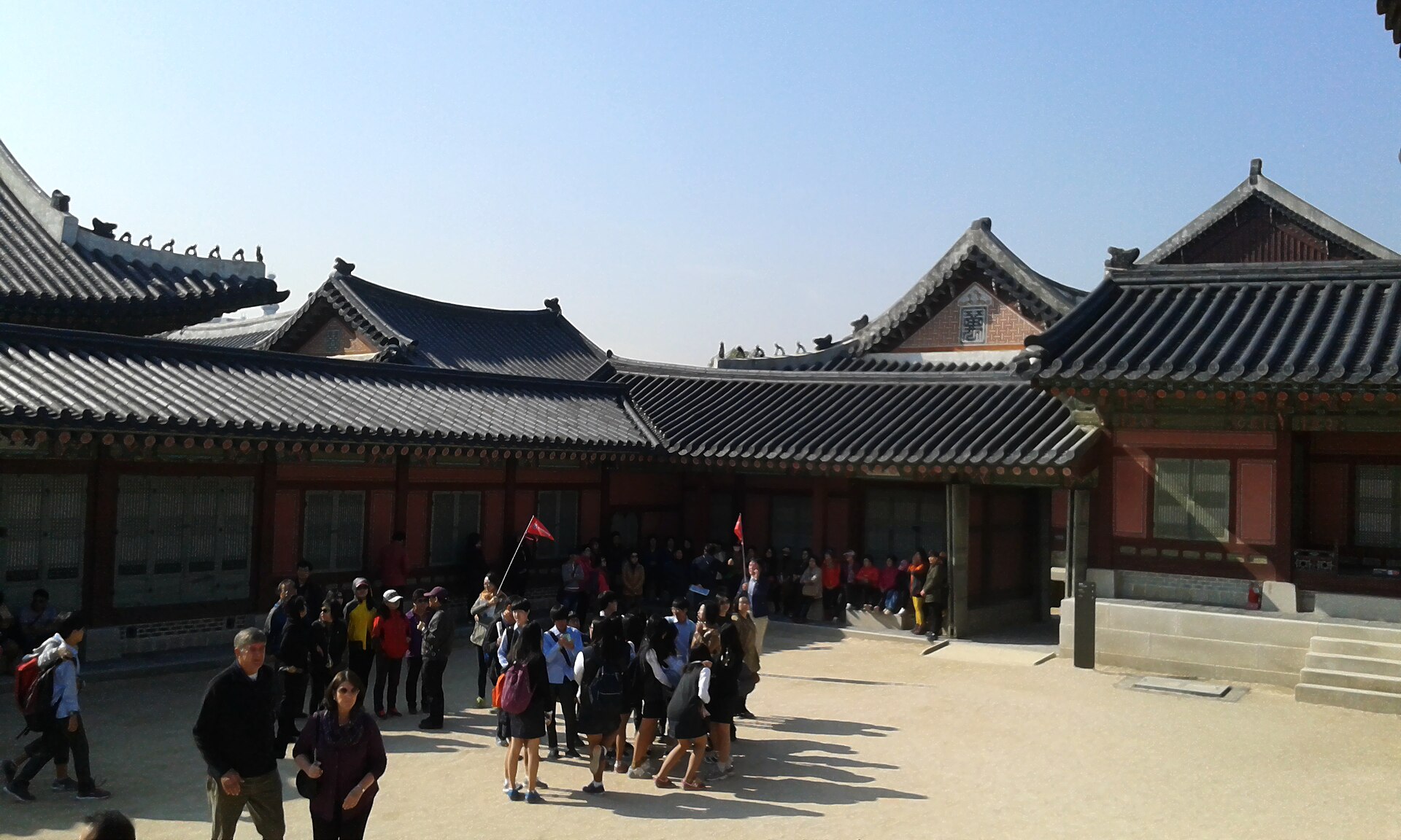 Visitors within the palace, moving through the halls and courtyards of the Joseon kings.