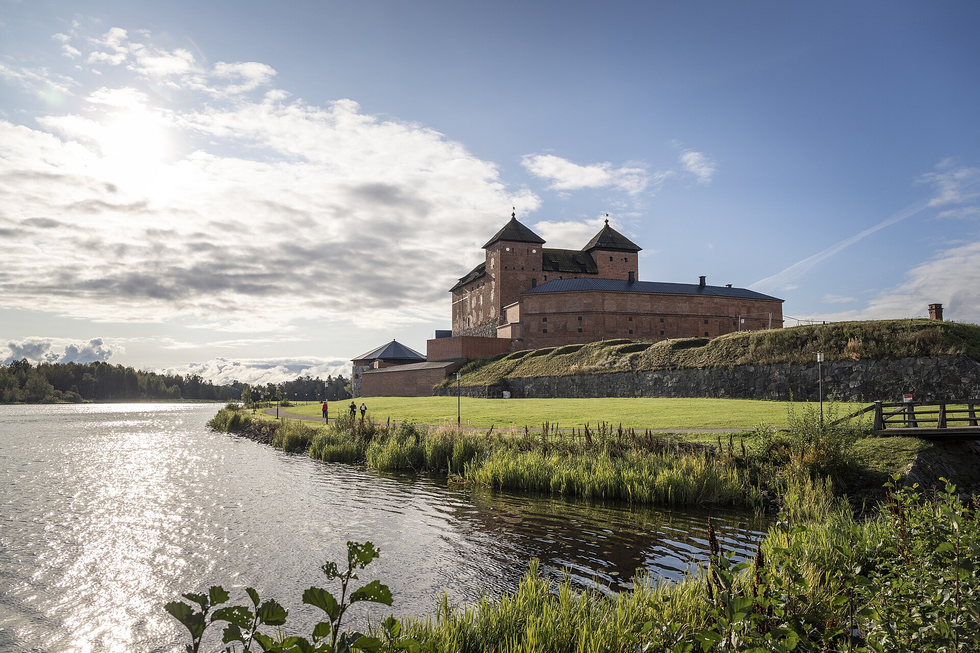 Guided routes lead visitors through brick vaults, halls, and the surrounding earthworks.