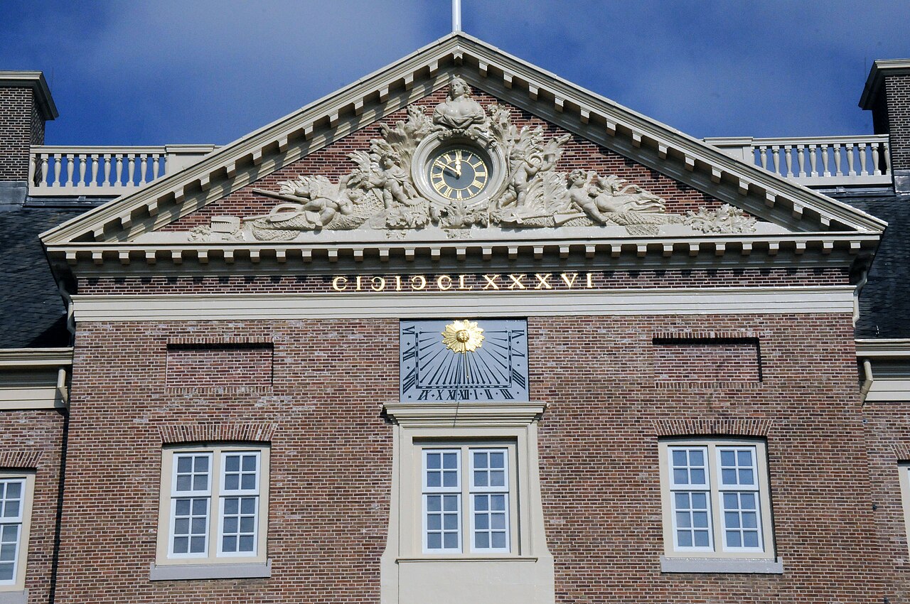 The carved tympanum above the palace entrance.
