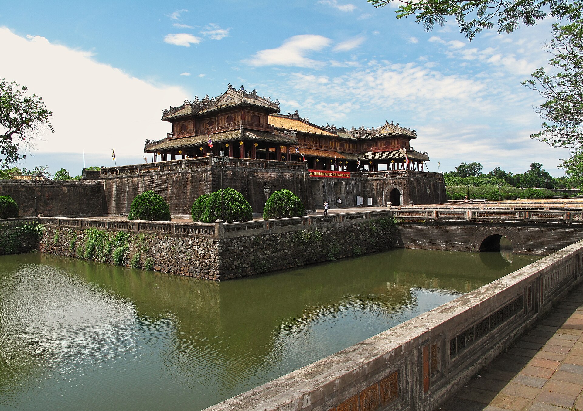 The Ngo Mon gate seen across its courtyard and ornamental bridge