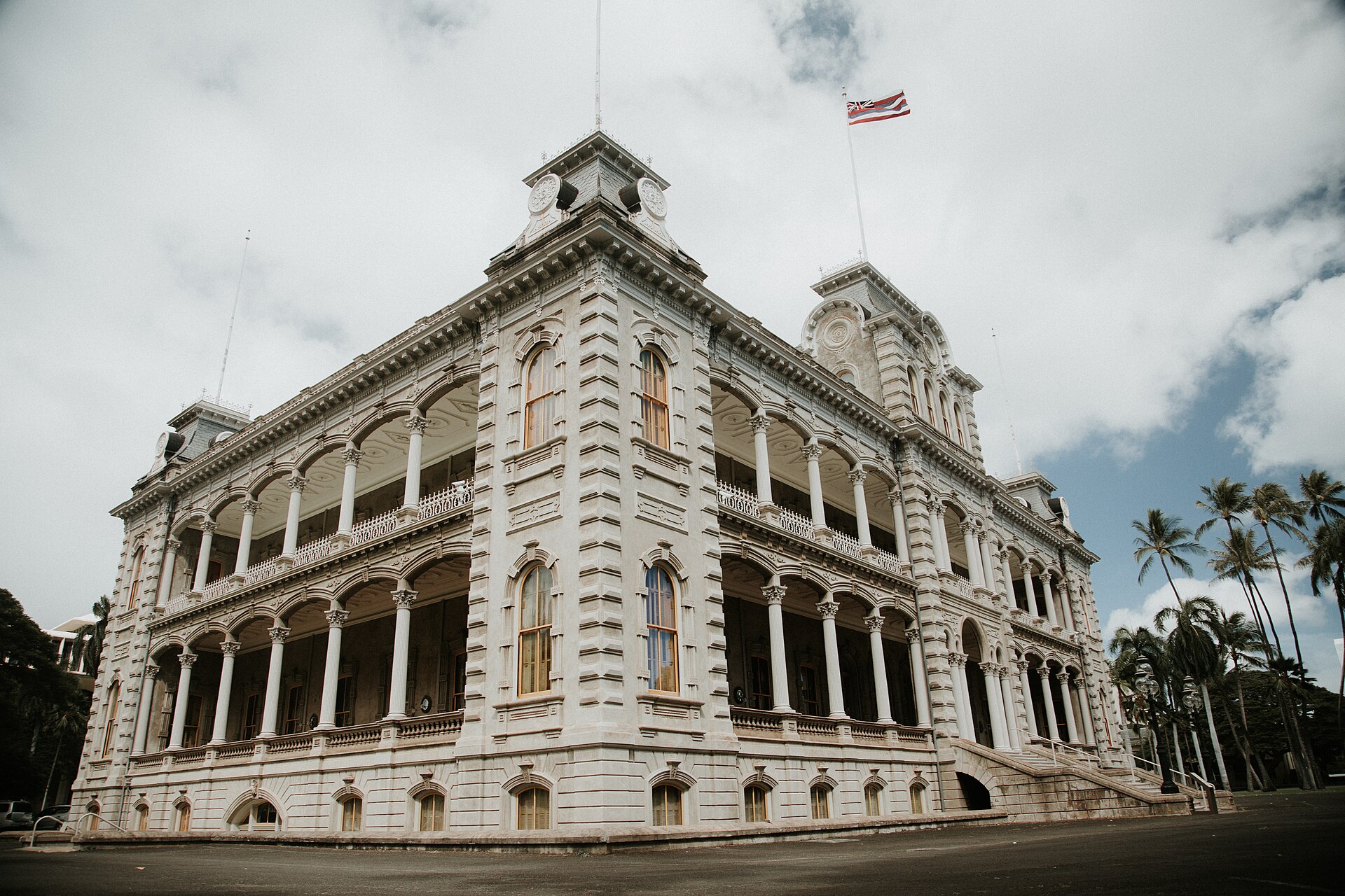 The palace in the heart of downtown Honolulu, surrounded by the modern city.