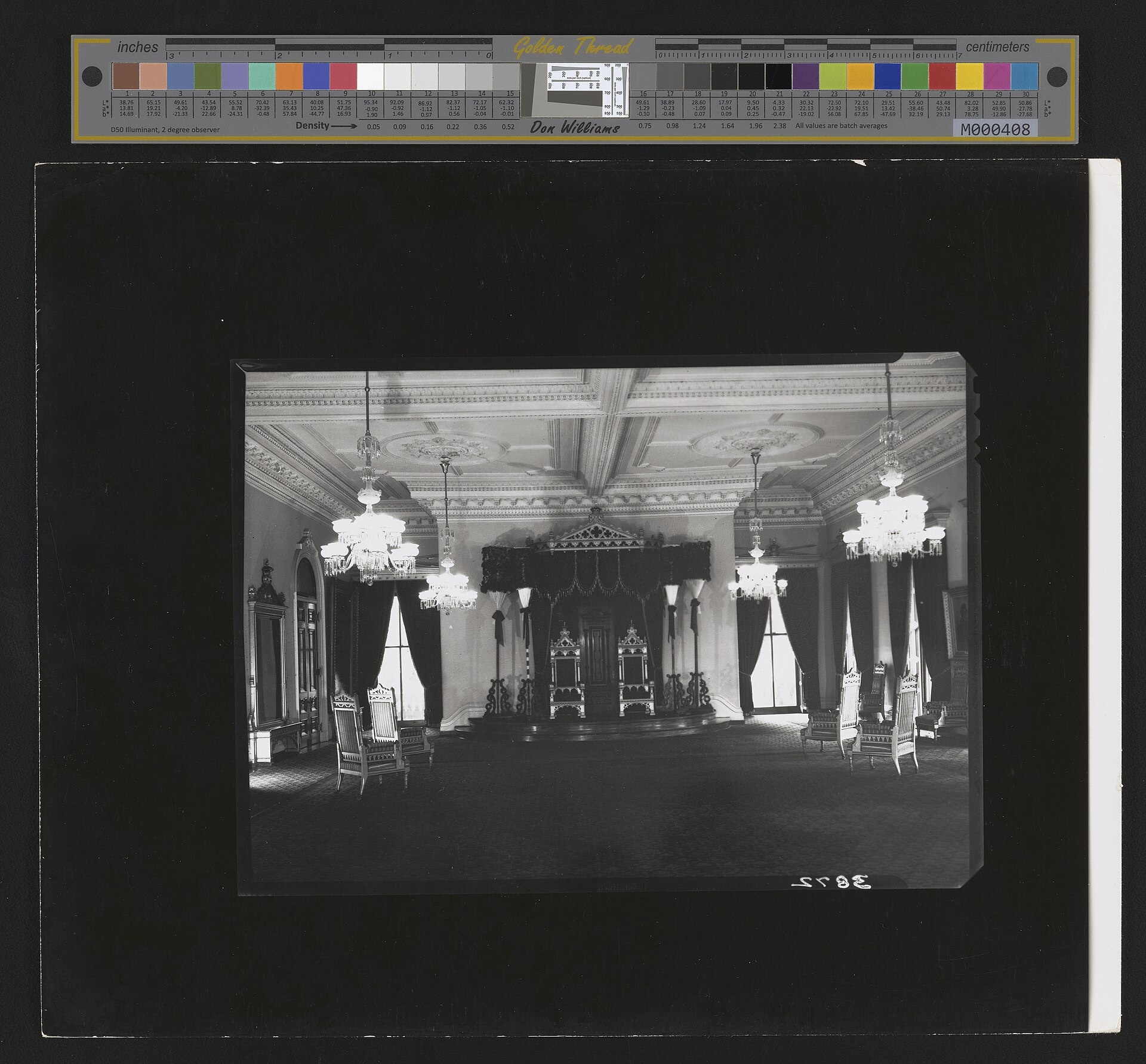 An interior of the palace, richly furnished in the manner of a royal court.