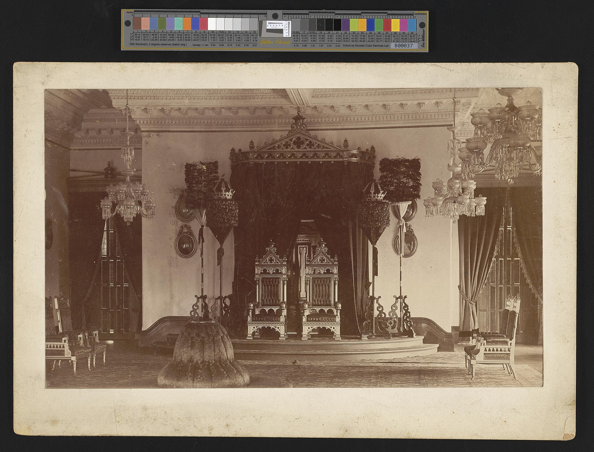 A room of Iolani Palace, decorated with fine woodwork and royal furnishings.