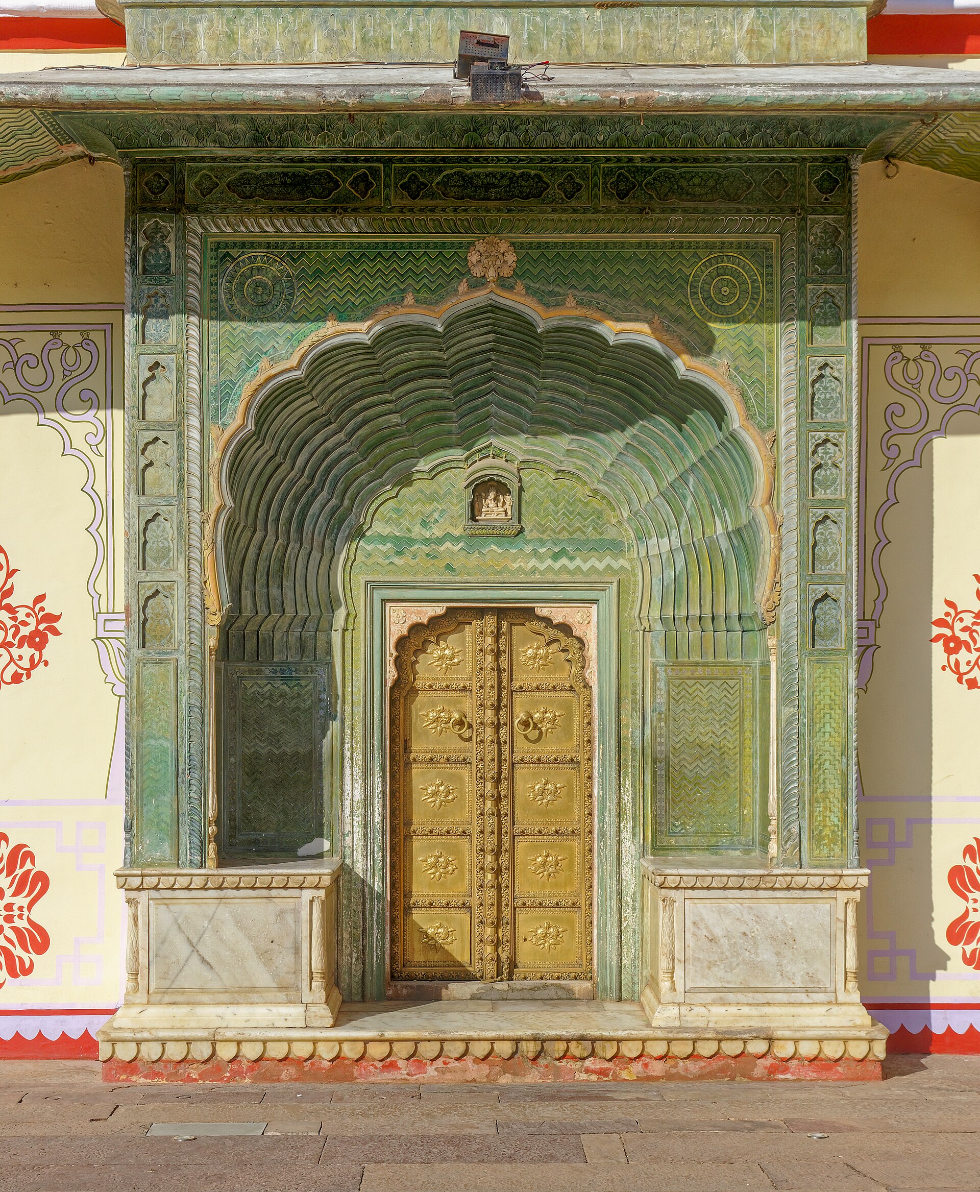 An ornate gateway of the palace, richly decorated and full of symbolic meaning.