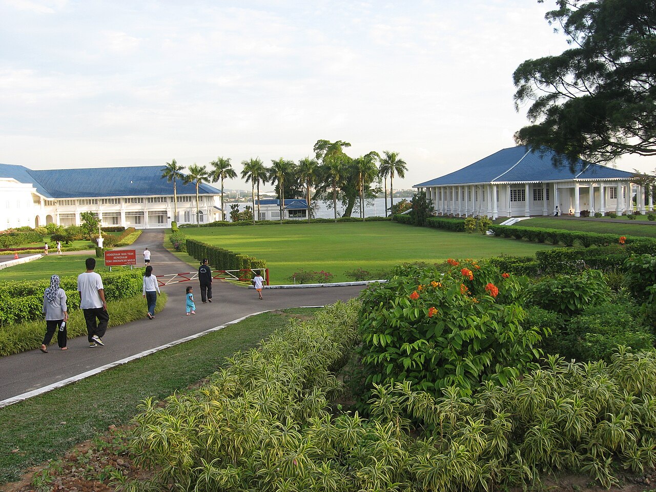 The palace set within its landscaped gardens by the strait