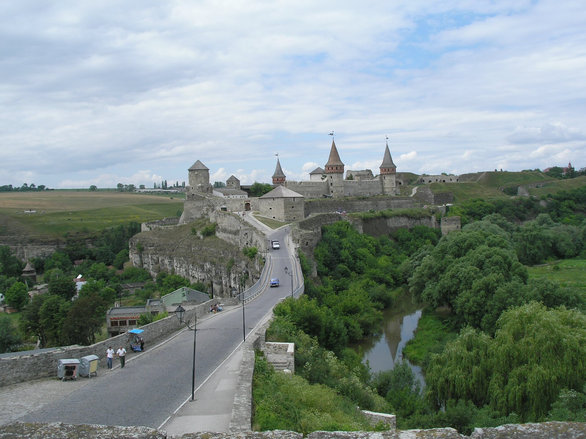 Kamianets-Podilskyi Castle guards a rocky peninsula in a deep river canyon.