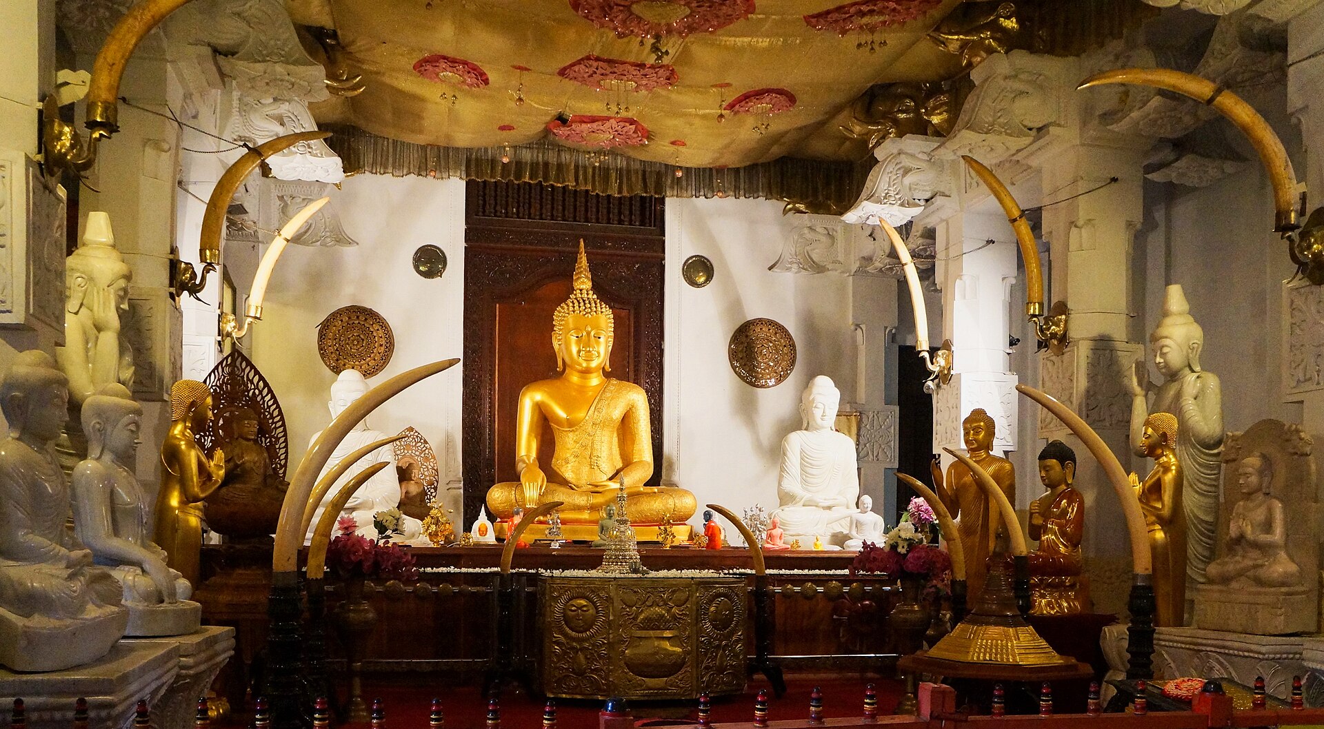 Sitting Buddha statues at the Temple of the Tooth
