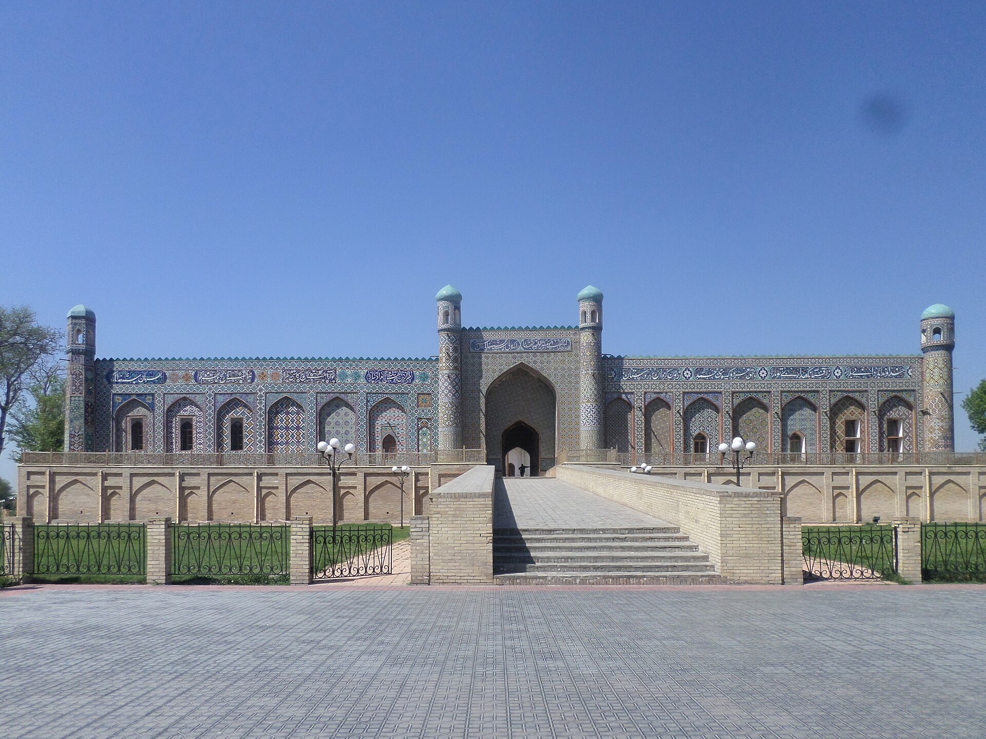 The Palace of Khudayar Khan in Kokand, its long tiled facade above the approach