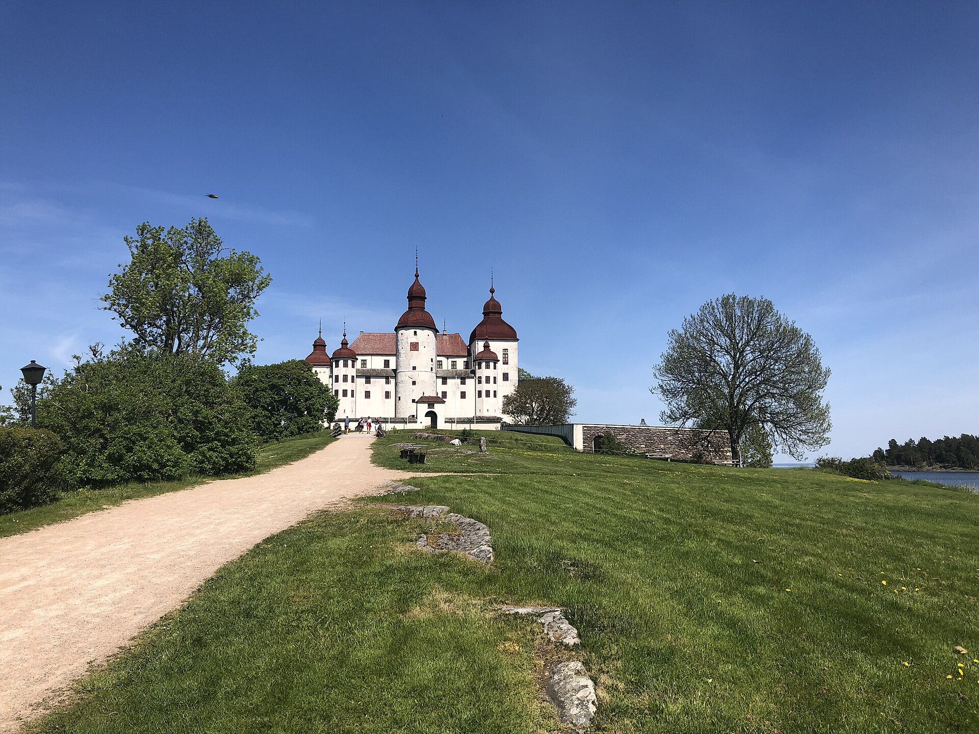 Läckö Castle rises in gleaming white above the shore of Sweden's largest lake.