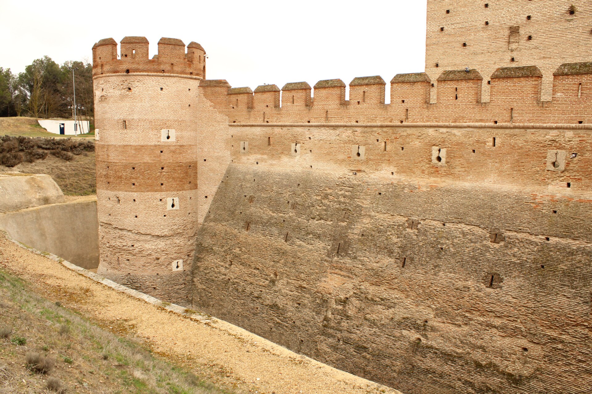 The great walls and tower of la Mota are built of warm red Castilian brick.