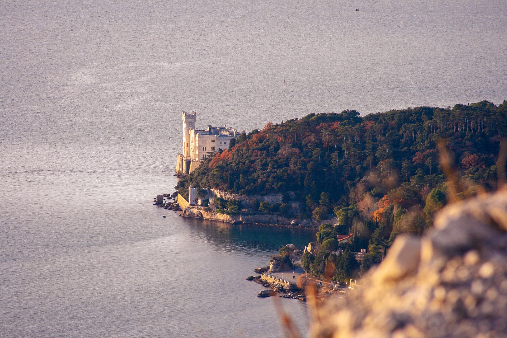Miramare on its rocky point, almost encircled by the waters of the gulf