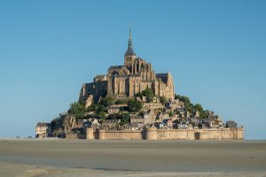Mont Saint-Michel rising from its bay at low tide
