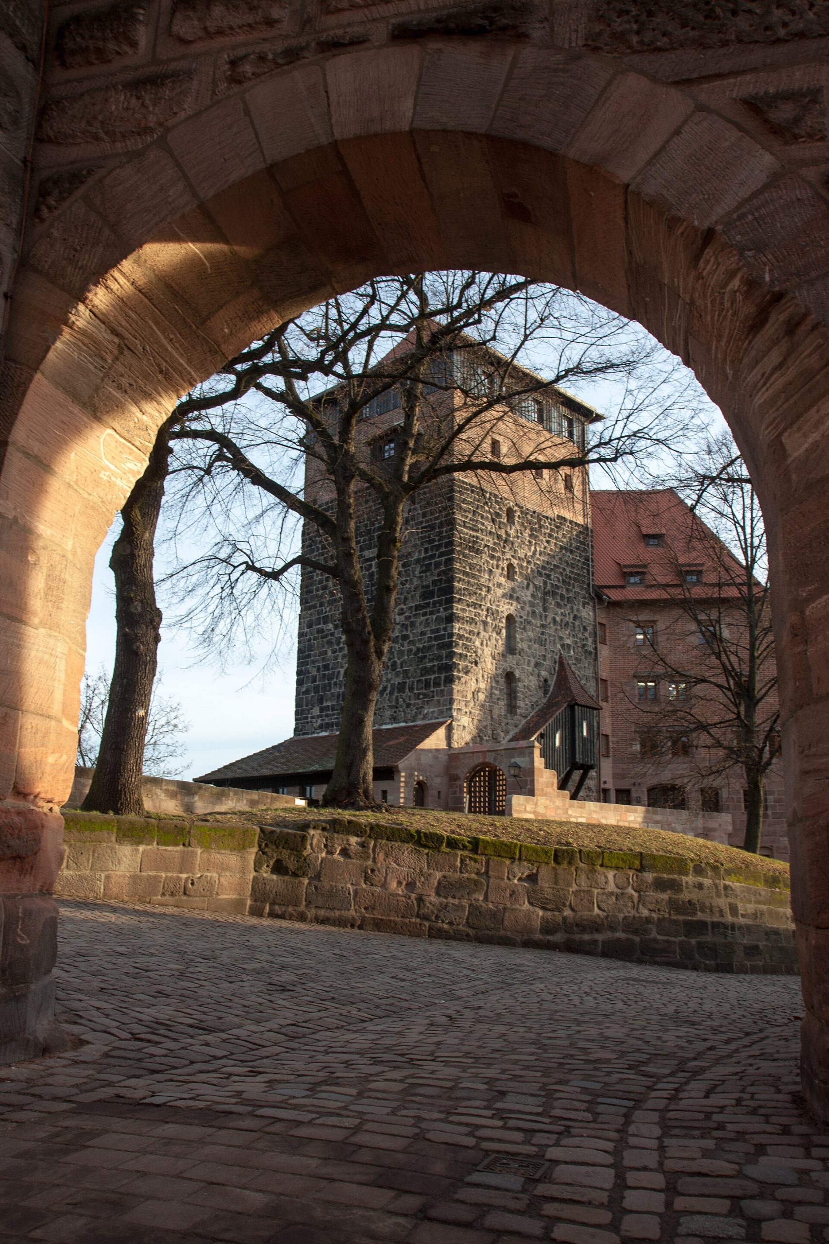 The castle above its city, waiting for the visitors who climb to it