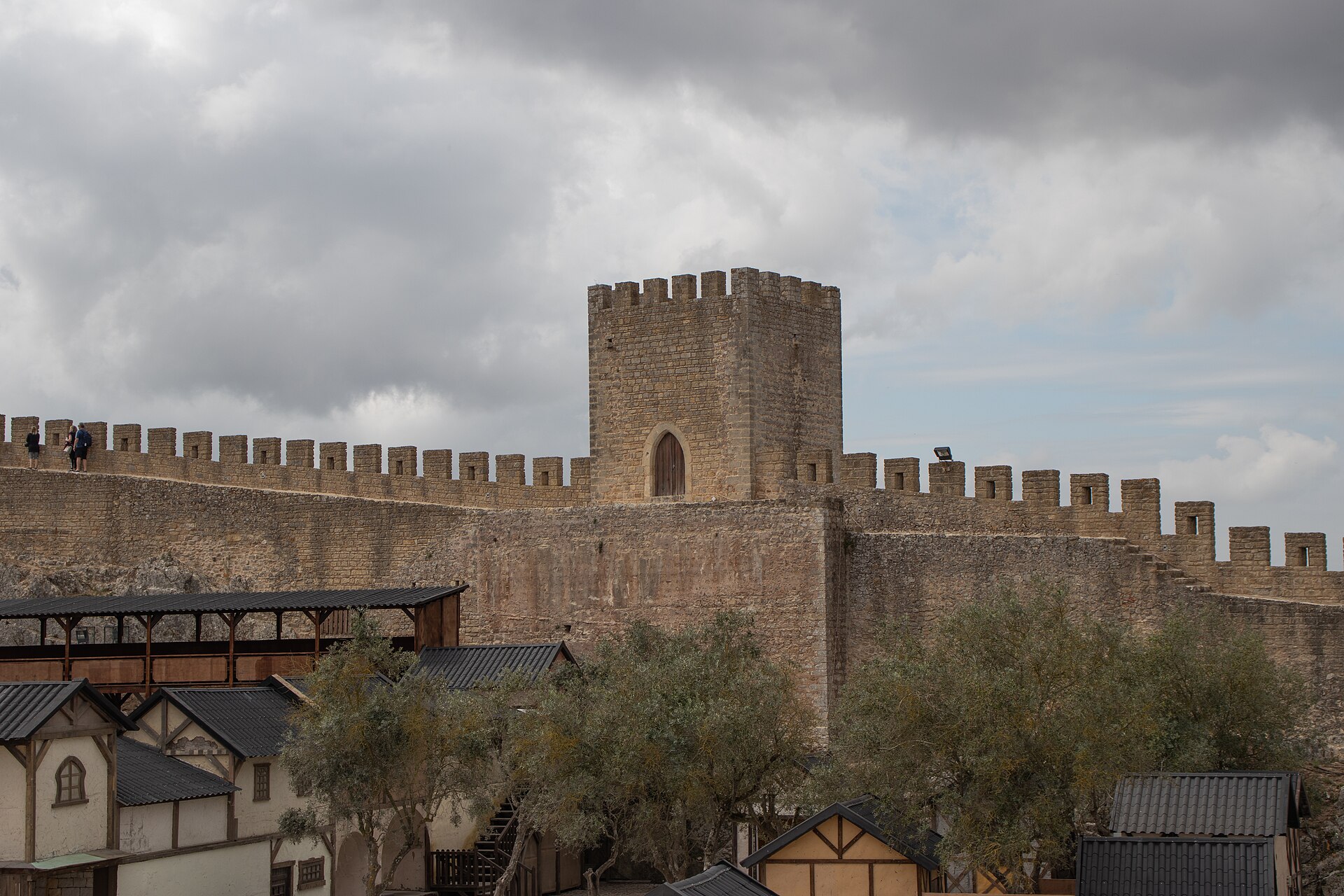 Towers rise along the walls, linked by battlemented walkways.