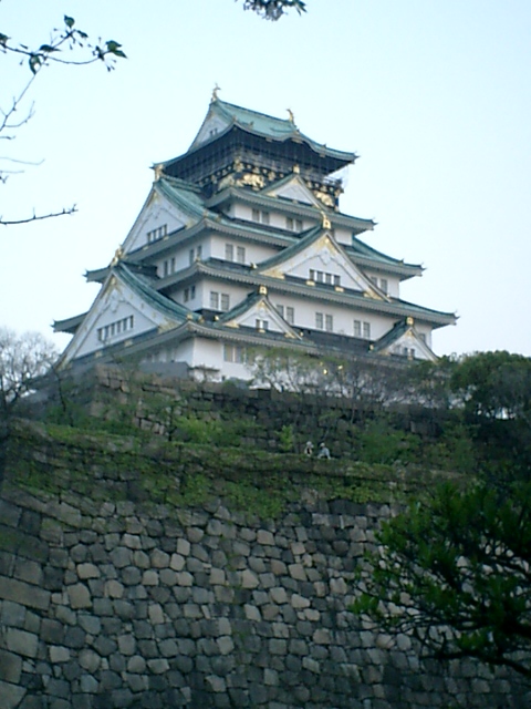 The reconstructed main keep of Osaka Castle rising above its stone base