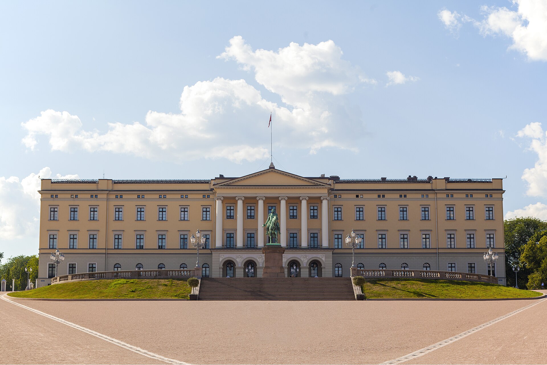 The pale yellow front and central portico of the palace