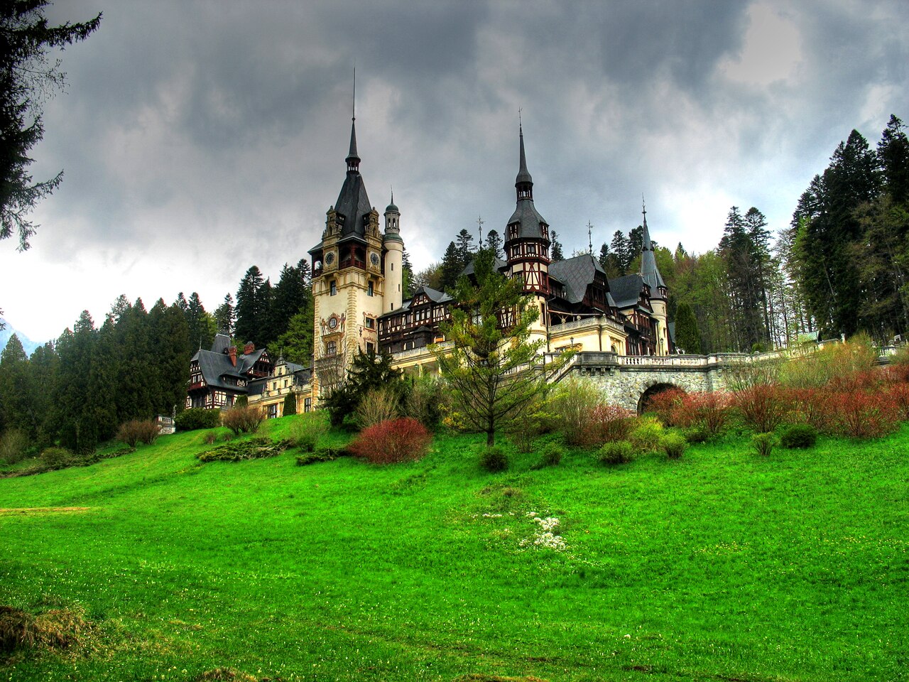 Peles Castle rising from the Carpathian forest near Sinaia.