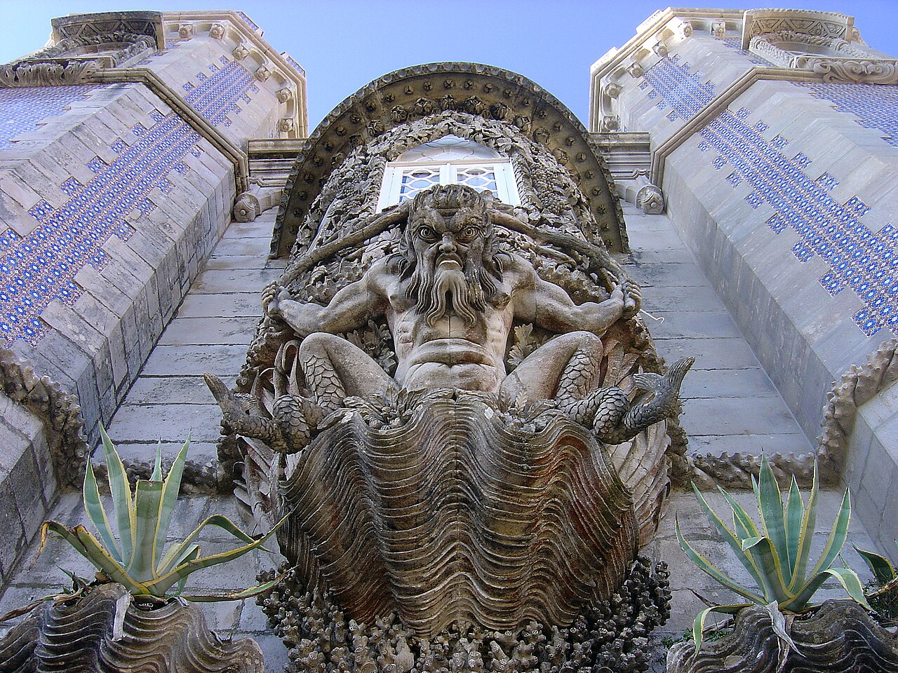 The Triton gateway, with its mythological guardian above the entrance.