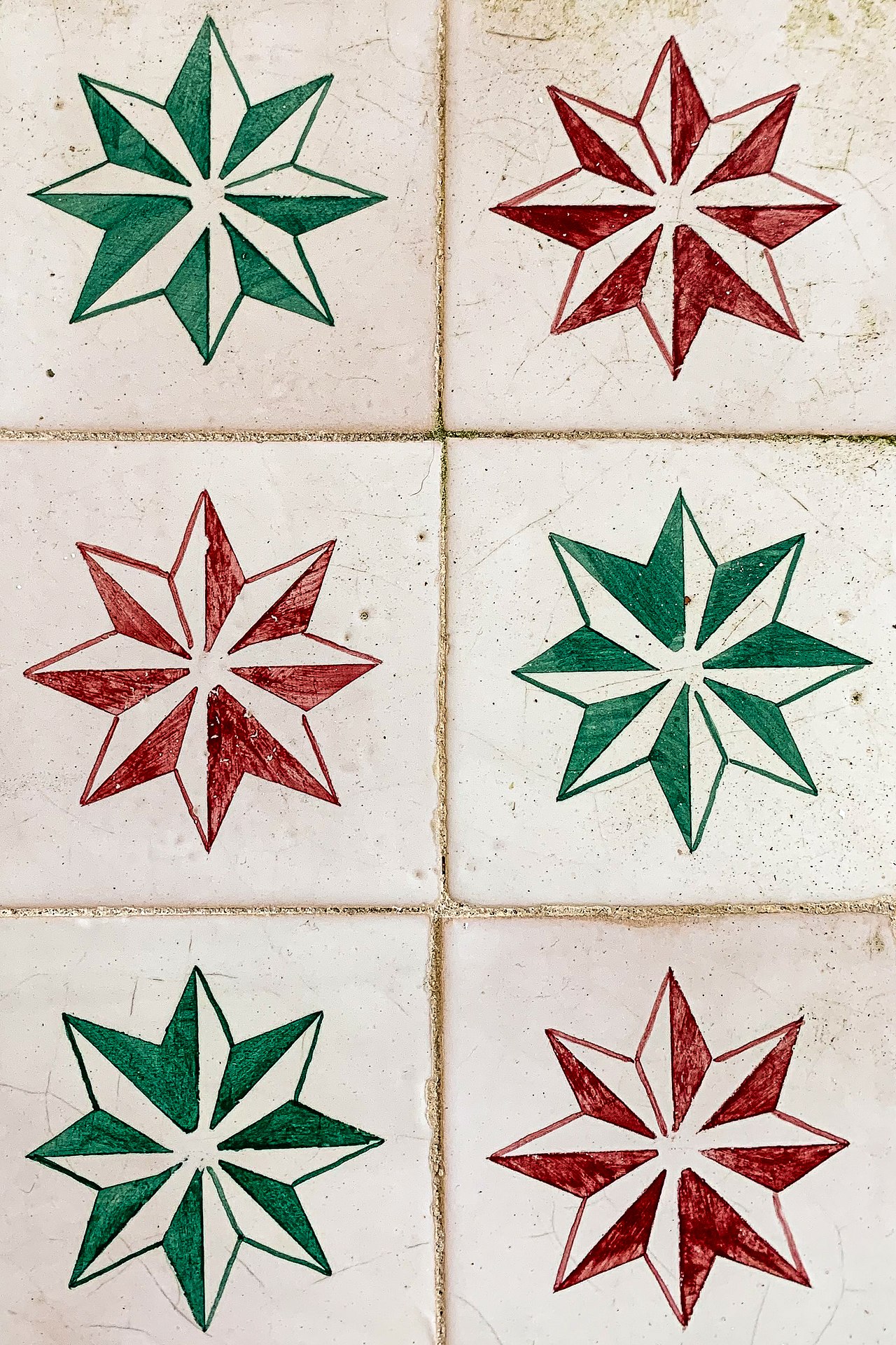 Red and green azulejo tilework decorating the palace walls.