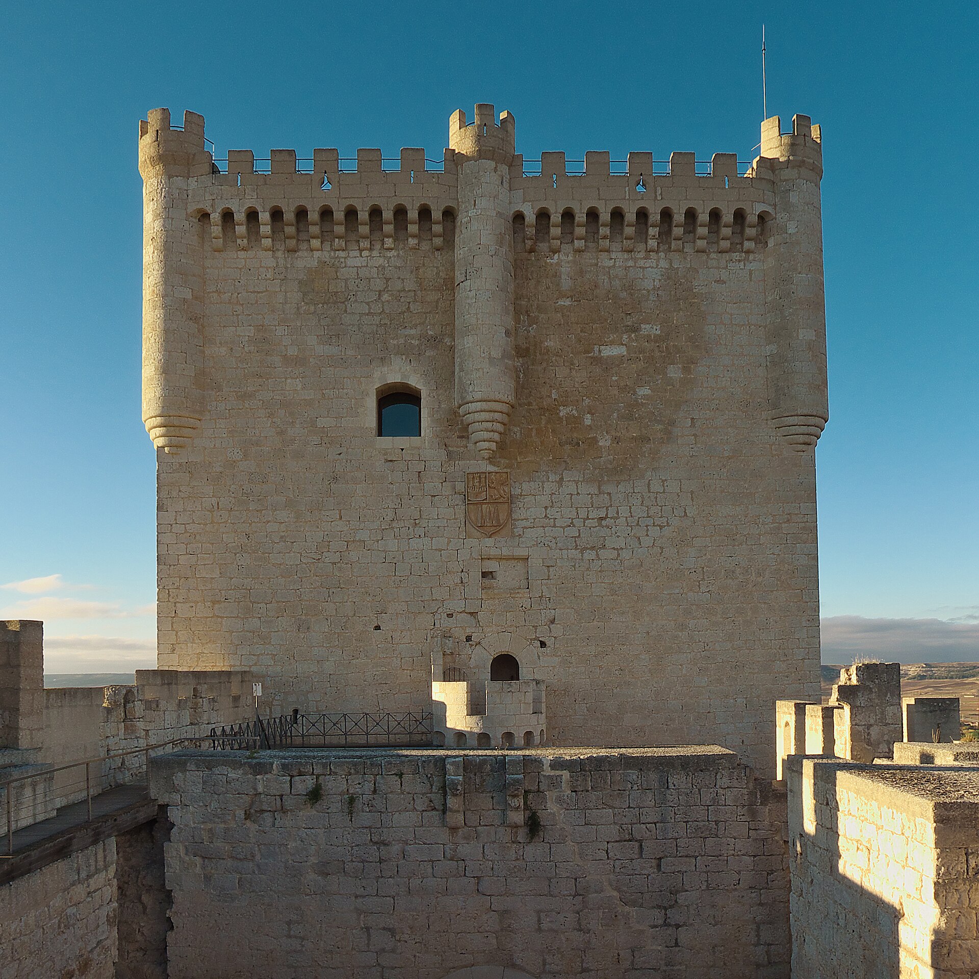 A tall central keep rises amidships like the bridge of a great stone vessel.