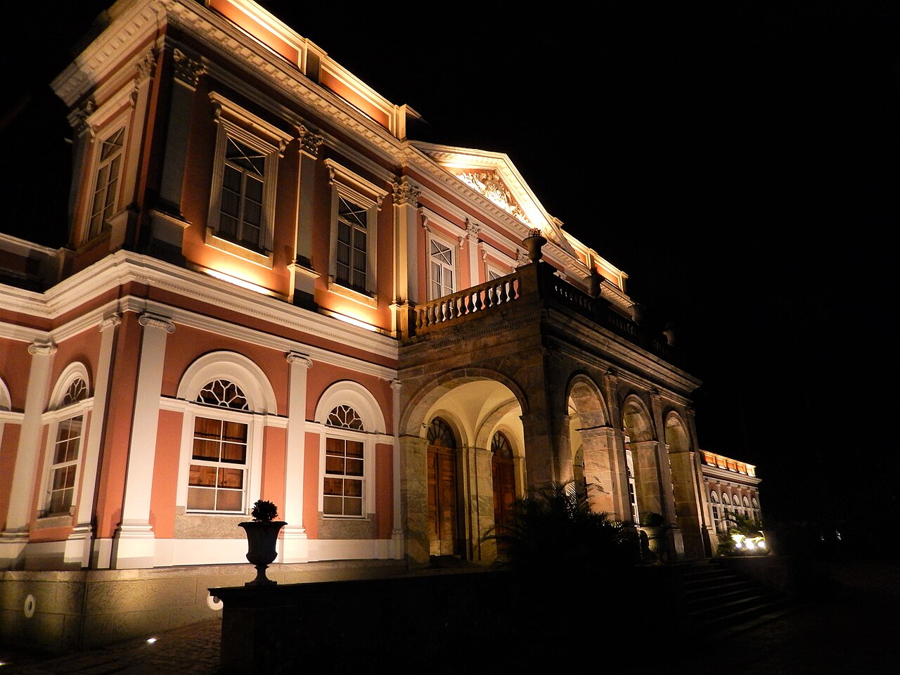 The illuminated palace at night.