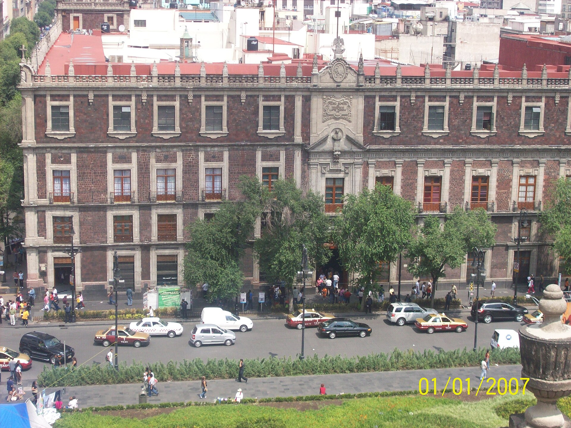 The long reddish facade of the National Palace