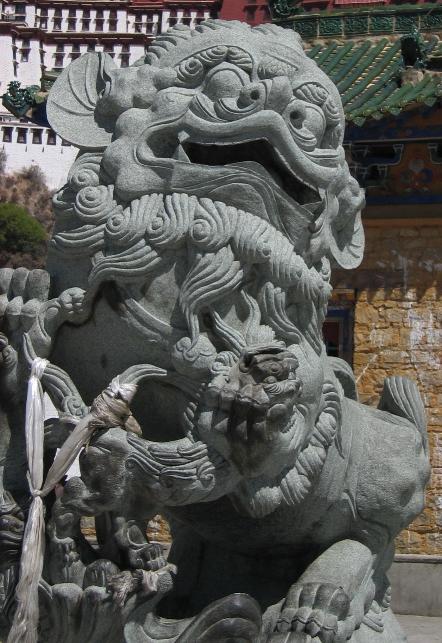 A stone lion at the entrance to the Potala Palace.