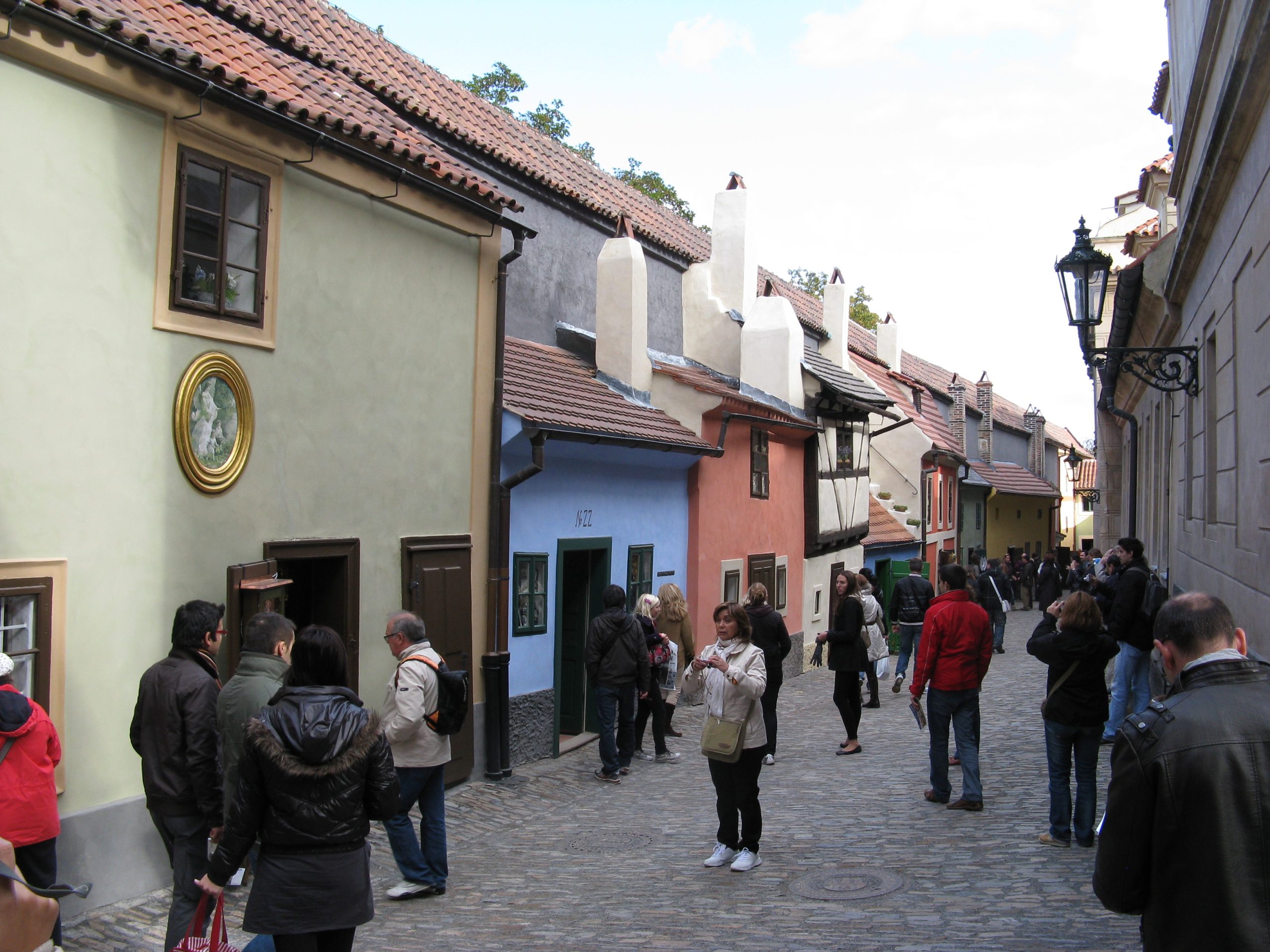 The tiny, brightly painted cottages of Golden Lane huddle against the castle's northern wall.